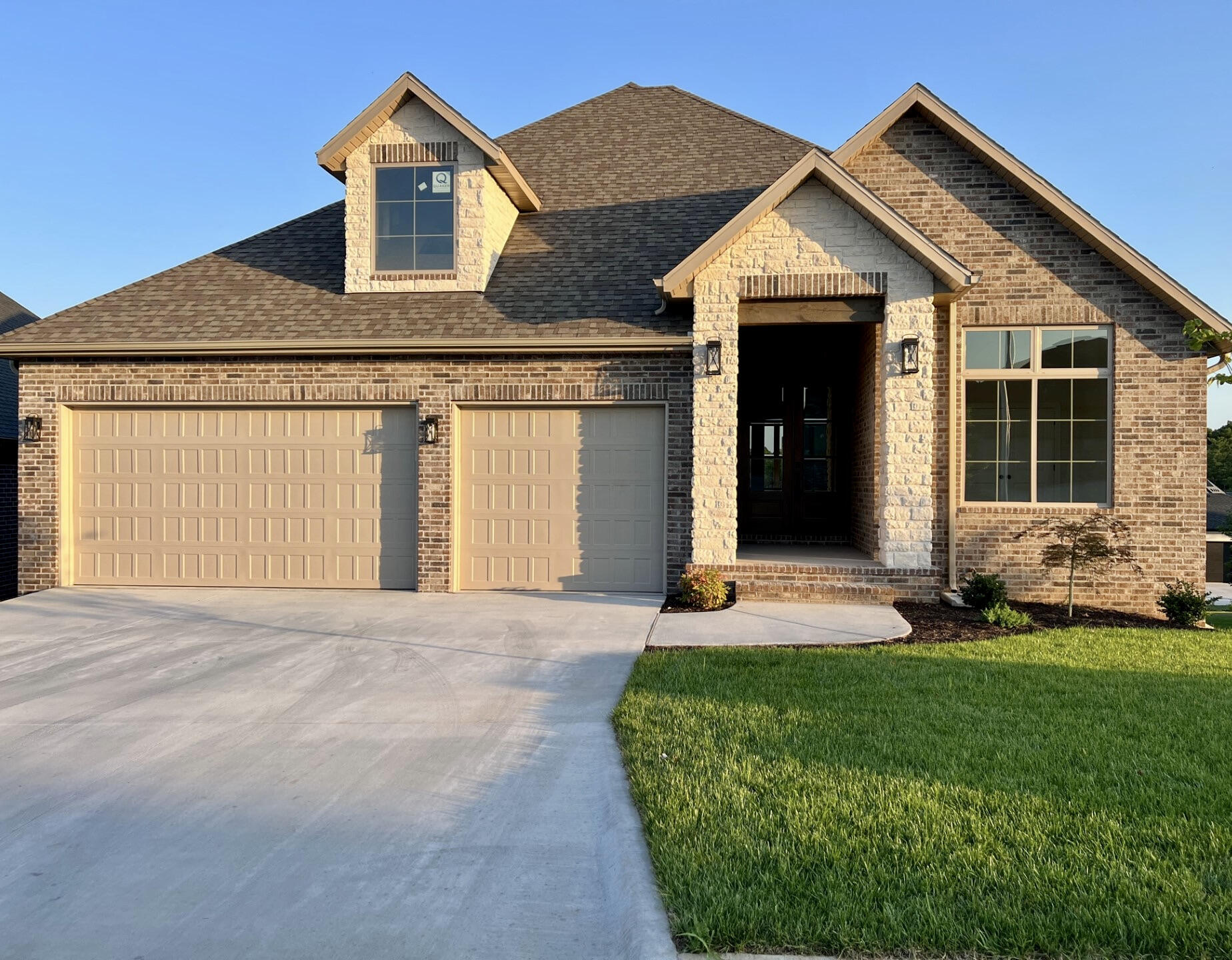 Welcome to Hickory Hills! You will love this gated subdivision with a beautiful setting and easy access to the Hickory Hills country club. This exceptional basement home is just completed with a gorgeous view of the golf course. Featuring 6 bedrooms 5 baths,  All brick and stone, an Impressive Open floor plan, 9 and 11 ft ceilings, basement bar, walk in pantry, quartz counter tops, two-tone Kitchen with stunning custom cabinetry, hardwood flooring, covered deck, storm shelter, lots of windows, and many more amazing finishes through-out! A must see! Don't miss this one!