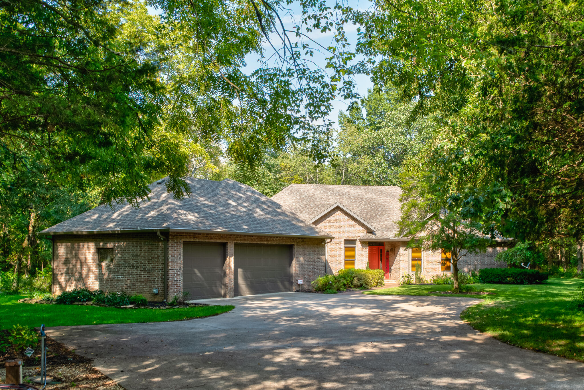 All brick home on 10 private wooded acres!! This home offers so much wildlife that you can view through your large windows or your screened in porch. One level home that features 3 bedrooms, 2 1/2 baths, 2 walk in closets in master, claw foot soaking tub in master bathroom, granite kitchen counter tops, large pantry, lots of cabinets throughout home, Irrigation system in front and back yard, oversized 3 car garage, office off the garage, storm shelter in garage, 10X24 storage shed with a 6X6 roll up door as well as one walk in door, lighting in crawl space, 3 sump pumps in crawl space, backup generator, 6'gutters and gutter guards, newer roof (less than 1 year old), fireplace with smart control thermostat and blower, RV hookup, and so much more.  This home comes with front load washer and dryer (with stands) and refrigerator.  Did I mention the utility bill is an average of $72 - a month!!!!!!