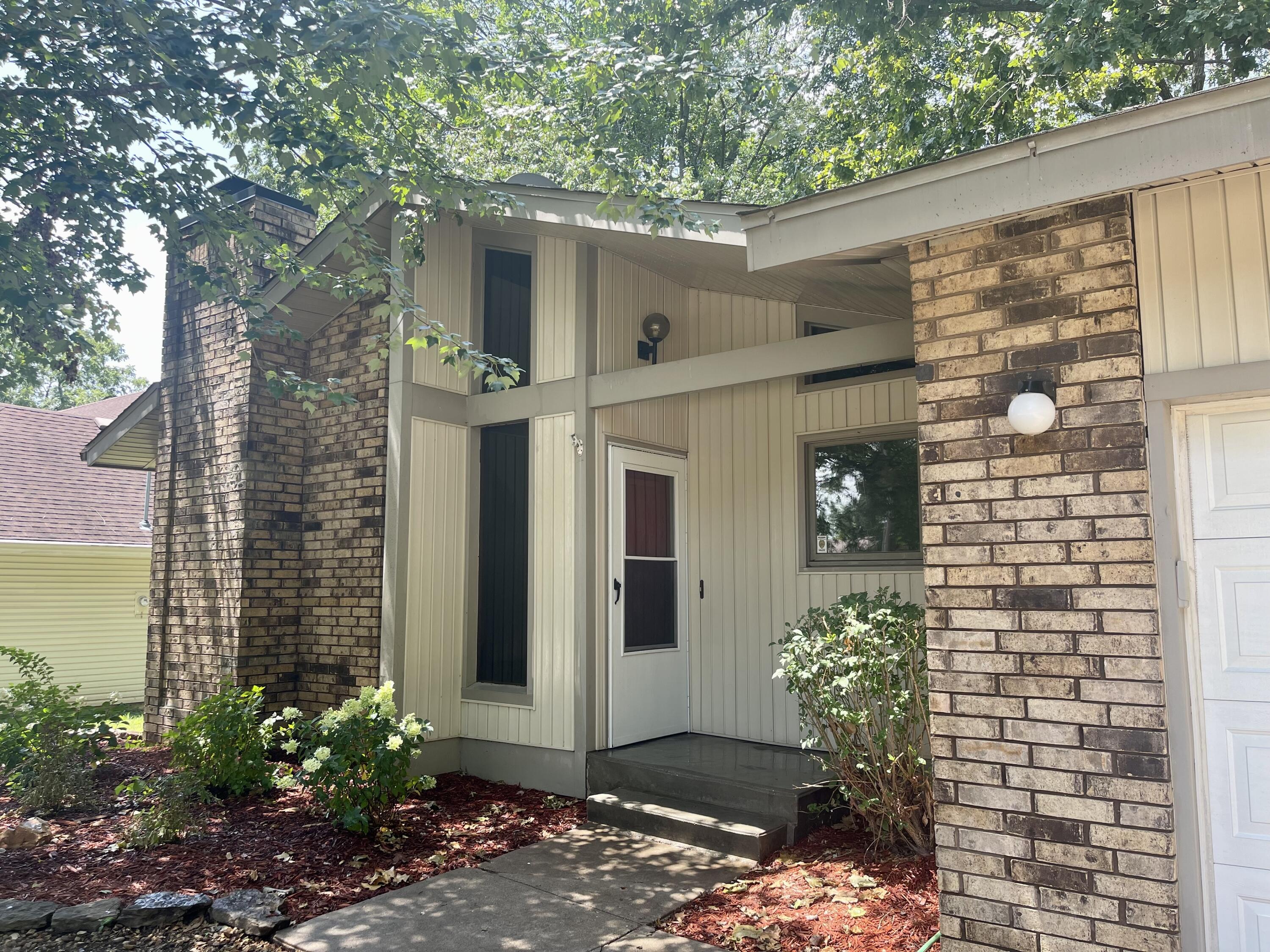 If you love the walking and biking trails and Nathanial Greene Park you are in luck!  Your new home will also be right down the street from the golf course. In the heart of SW Springfield and close to everything you might need you will find this carefully crafted home. You will love its unique features with a more contemporary feel. You will find wood beams, unique wood tiling in the kitchen and over fireplace.  Beautiful lead glass sliding doors and high ceilings all give this home its appeal. Lots of great natural light too.  New flooring throughout the house, all new appliances, New hot water heater, new landscaping, new paint, all new textured ceilings, new trim and cabinetry refurbished like new. New roof and gutters to be installed in August and should be complete by closing. Still a few finishing touches to the inside but it's ready for your viewing.