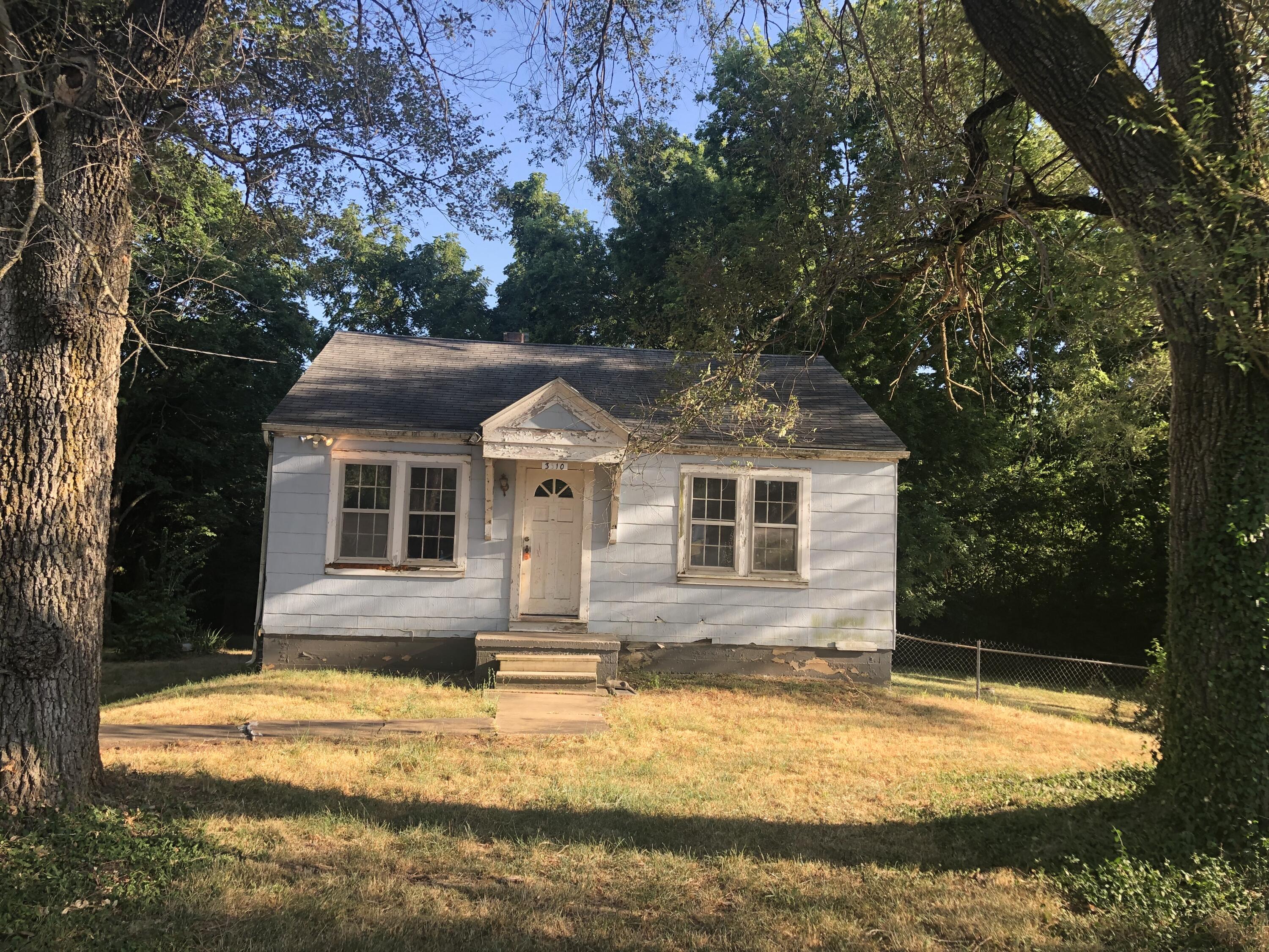 Solid bungalow having full basement on 3/4 of an acre in city limit is very hard to find. House has 2 bedrooms, 1 full bathroom and all original hardwood floors in the house. Seller fixed complete electrical, Plumbing and gas issues. It will be ready for someone who can live and work on it. Enjoy countryside feeling while living in the city. Listing agent is part owner of the LLC (Seller)