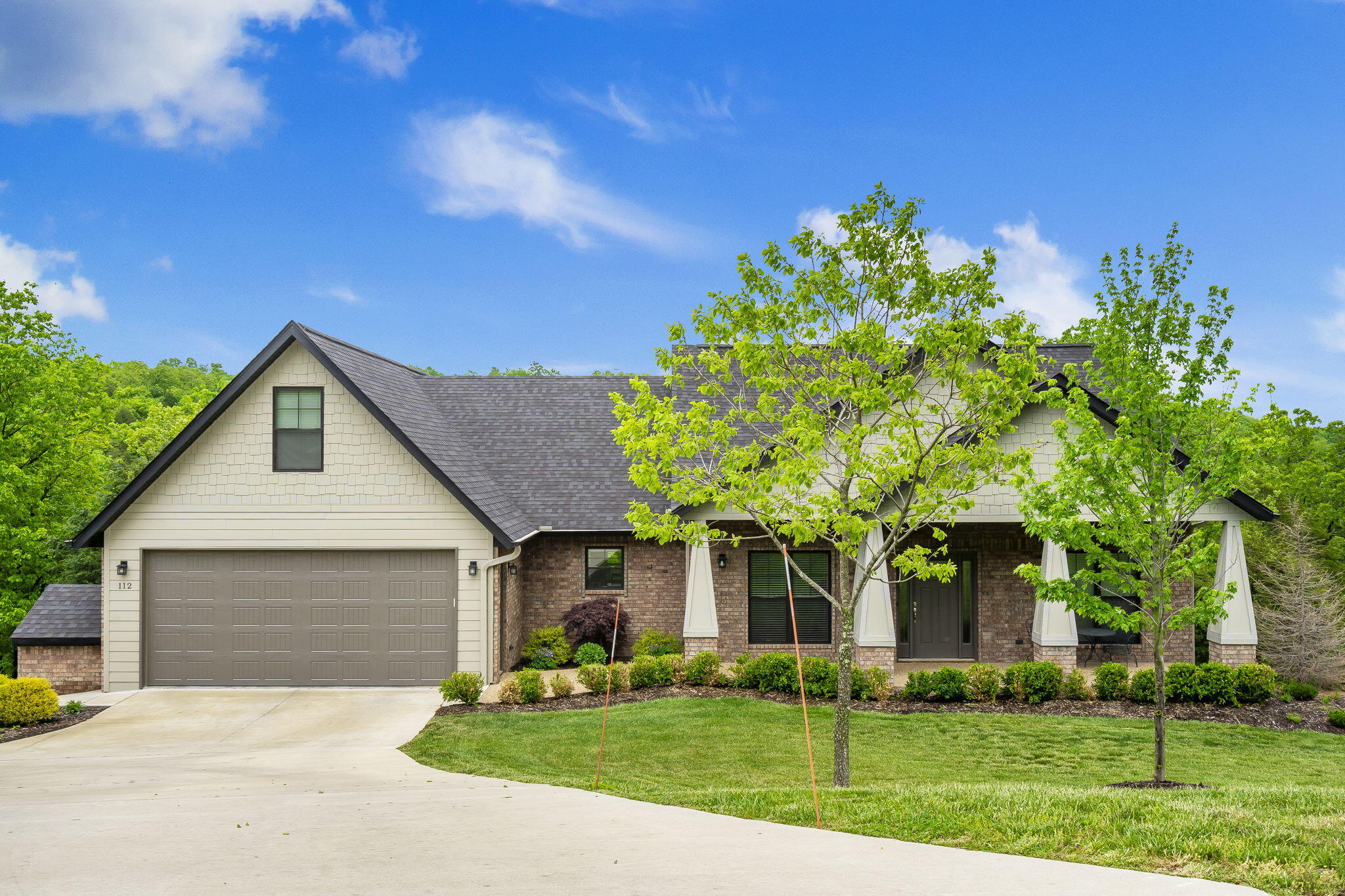 Welcome to your New Home in the hills of Saddlebrooke, only 15 minutes to Branson. This home was custom built for the owner with a SWEEPING VIEW of Saddlebrooke valley. When you open the front door you will see the magnificent view overlooking the trees on your 1+ acre manicured lot. This home has all the special touches such as an open floor plan between the kitchen and living room which is perfect for entertaining family and friends. Notice the custom wood beams in the vaulted ceiling above the living room and the easy to use gas fireplace at the touch of a button. The Kitchen includes a Gas Range and Oven (also wired for electric) and Refrigerator. You will notice the quality custom wood cabinets and a high bar for family and guests to enjoy a quick meal. There is also a dining room with a Bay Window adjacent to the kitchen which looks out over the lush green forest. The Main Bedroom is located on the entry floor with plenty of room for your King Bed and all your furniture. The Main Bathroom has double sinks, His and Her closets, and a Walk in Shower. There are 3 bedrooms all on the entry floor. This house was designed where you can do all the living on the main floor without any stairs. Upstairs you will find a large possible 4th bedroom with over 300 sq feet! All you need to do is add a closet and you have a 4th bedroom. Downstairs you will find a hidden gem of 400+ sq ft, which could be turned in to so many possibilities and is dry-walled with heat and air. There is also a side door garage to keep your mower for taking care of your yard. There is a tool room, work room on this lower floor. The front and backyard includes sprinklers with a timer. This property is kept freshly cleared and mowed with selected trees remaining. There is also a deck on the main floor to enjoy your coffee or iced tea and enjoy the peaceful beauty of the Ozarks. This home has YOU in mind! Make sure to schedule a time to see it before it is gone.