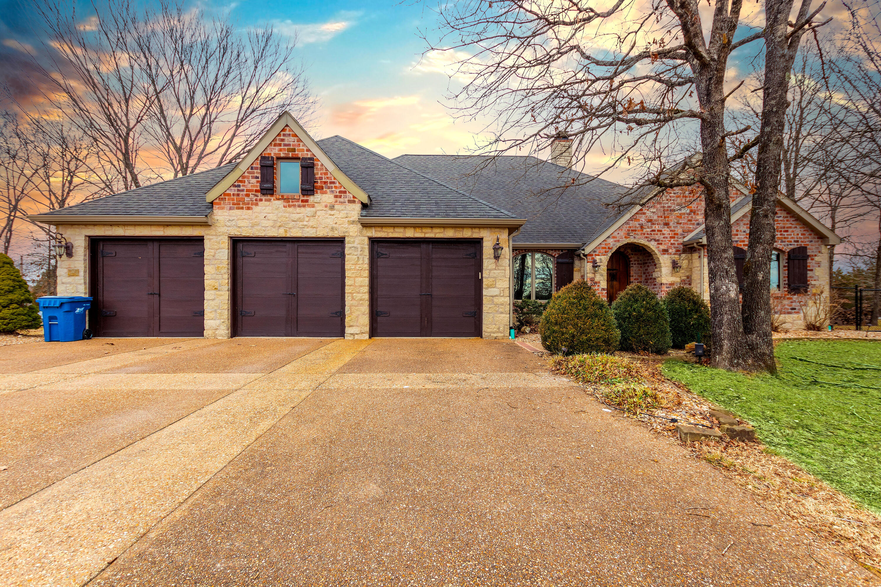 Beautiful Custom Built 5 bedroom 4 1/2 bath home sitting on 1.52 fairly flat acres.  3 Car deep garage with built in shelving. Just outside of Branson so a country feel yet only 1 exit away from schools, shopping and dining.  Backyard is fenced and setup for entertaining with a hot tub, fire pit, axe throwing target, and large basketball pad and goal. Main bath has steam shower and air therapy tub. The office/study could be a 6th bedroom. Family/Game room on lower walkout basement level with wet bar area and is wired for surround system. Home is brick and stone so low maintenance. Home shares well with 2 neighbors but has its own water chlorination system. No HOA. Home sits at the end of a quiet cul-de-sac. Schedule your private showing today.