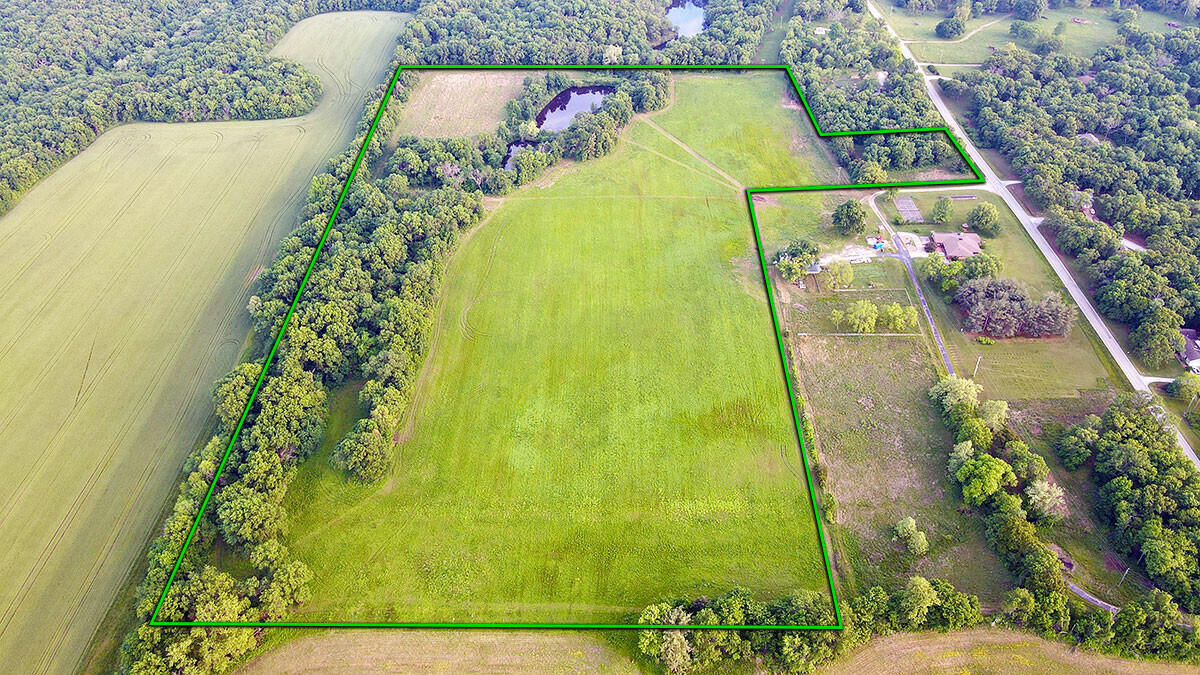 Every now and then a property hits the market that checks all the boxes. This is the one you have been waiting on! Just a short drive south of Nevada, MO sits this diverse and secluded +/- 36 acres (survey to determine actual acreage) with BB Hwy road frontage. This property boasts a perfect mix of tillable/pasture ground and large mature timber. Check out the secluded 3 acre field in the SE corner of the property overlooking the 1 acre pond below. Build your dream home here, among the towering Red and White Oaks that dominate the canopy of the +/- 11 acres of timber. Break out the fishing poles and cast a line in either of the two ponds, filled with all the fish you can catch. In the springtime, grab your gun and turkey call and watch God's creation come alive while waiting on one of the numerous tom turkeys that roost on and travel through the property. The current owners see numerous deer and turkey on a regular basis in the open fields that comprise +/- 24 acres of the total acreage. This was very apparent when I was touring and taking pictures of the property. I came across numerous wildlife trails and the gobbling tom turkey in the main field seemed to never run out of things to say. What a dream! DON'T MISS OUT ON THIS PROPERTY!!