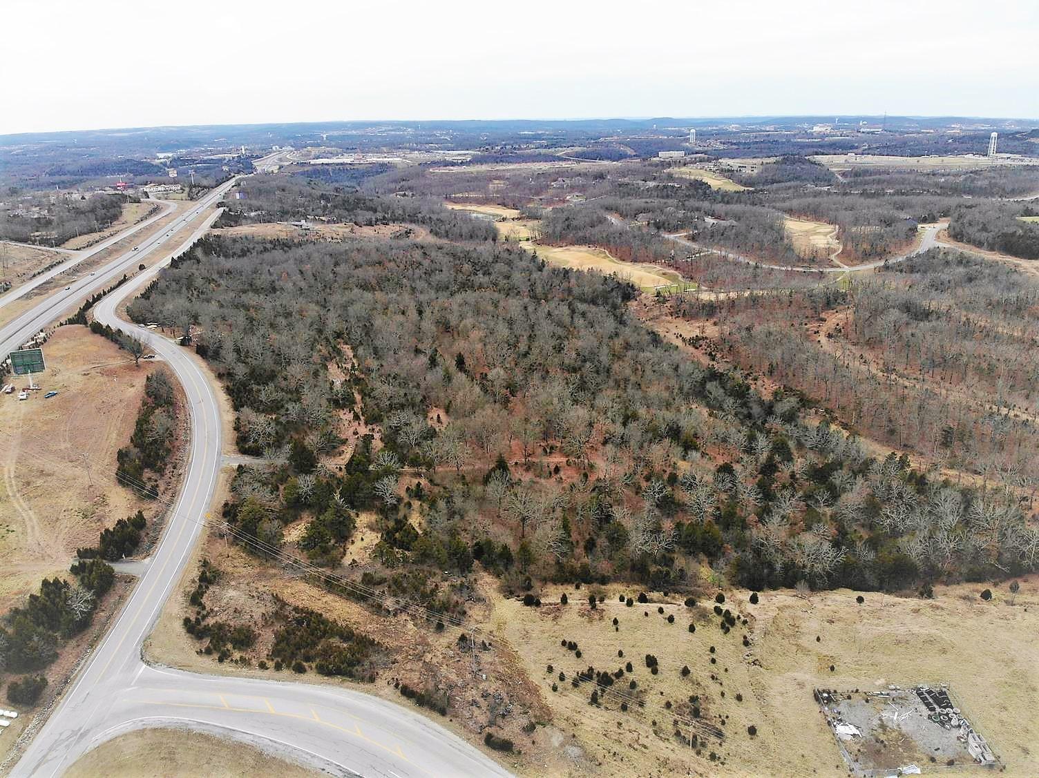 53 Acre Commercial Opportunity on Hwy 65. North side of Branson. 2300 ft on Sunrise Dr and 1500 ft exposure to Hwy 65. Just south of the Ozark Mountain High Rd and Hwy 65 intersection. Backs up to the Branson Hills Golf Course.