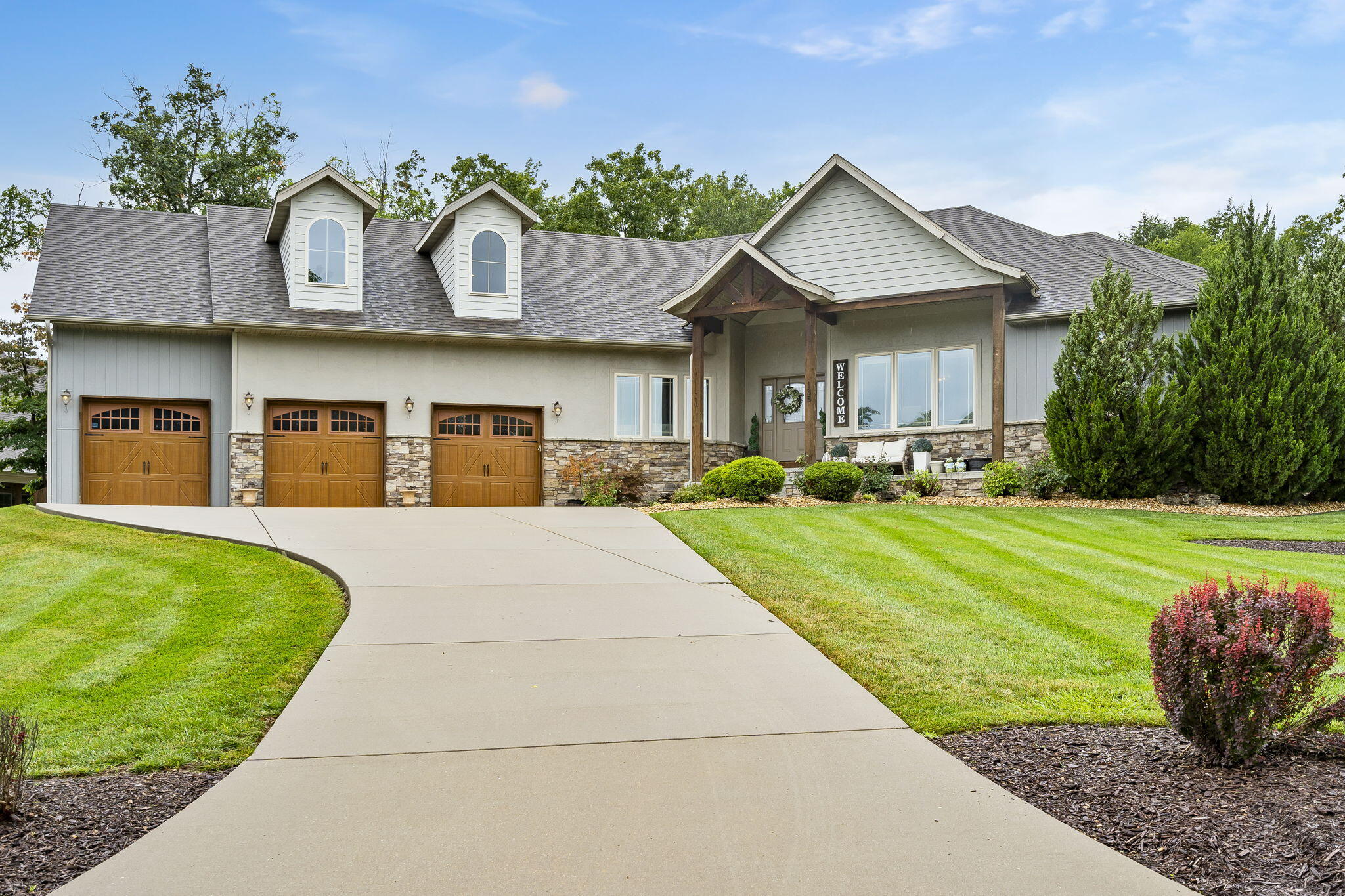 If you're looking for luxury living then look no further than 135 Troon Circle in the Branson Hills Golf club. This custom home is nearly 4000 sq ft. Everything except the large bonus room (5th bedroom) is located on the main floor. From the moment you walk in you will be in love. This home features tall ceilings, an open floor plan that is perfect for entertaining and has all the upgrades you could want. The kitchen is beautifully done and has a huge island that can fit 6 people. There is tons of storage and even a huge pantry. The primary bedroom is enormous and has access to the back yard, the dog run area, and connects to the large en suite bathroom. The primary bathroom flows right in to the large closet and has access to the laundry room making things very convenient. The other two bedrooms on the main level share a connected bathroom with a large walk in shower. The kitchen, living and dining areas are open concept which makes entertaining a breeze. There is also a beautiful screened in porch that you are sure to enjoy. Right outside of the porch is the hot tub area and a concrete basketball spot. Even the garage is upgraded. It can easily hold three vehicles and is oversized so you can fit your toys and storage. This house screams fun, luxury and comfort. And all of this comes with the prestige and amenities of the Branson Hills Golf Club. Community amenities include a gated subdivision, clubhouse with bar and grill, swimming pool, tennis courts, a world class golf course and more. Don't wait, call for your private tour today and don't forget to take the 360 degree virtual tour.
