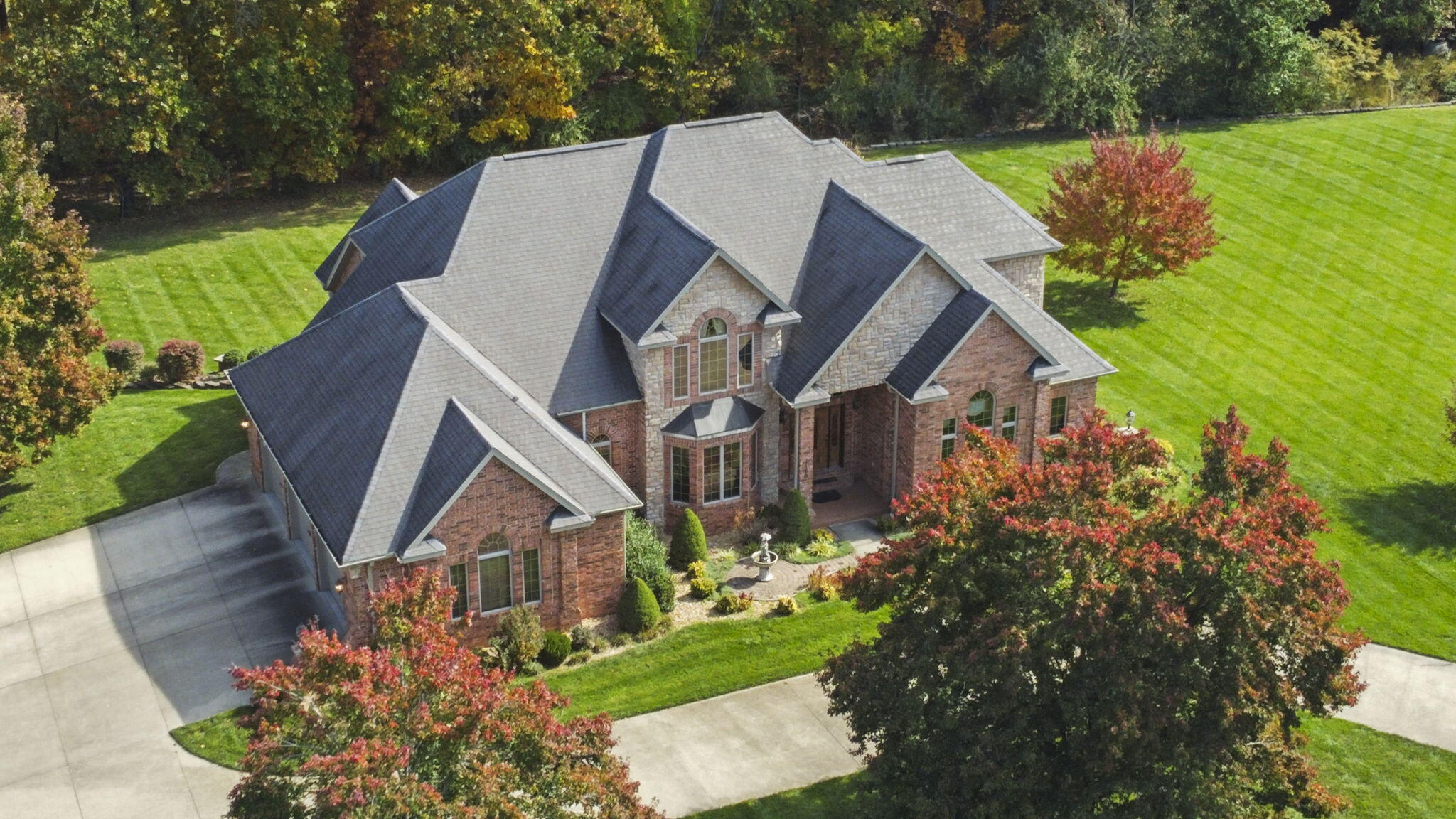 Welcome to 1160 Sarah Street, an exceptional estate nestled within the serene beauty of the Missouri Ozarks in Howell County. This exclusive property, situated on a spacious .69-acre lot within the prestigious Woodridge subdivision, offers the epitome of luxurious living.Features:1. Expansive Space in the Missouri Ozarks: Boasting over 6000 square feet of meticulously designed living space, this Howell County gem offers plenty of room for family and guests alike. With 6 bedrooms and 5 baths, this property is perfect for those who cherish space and comfort. The basement features full living quarters, providing a secluded retreat for extended family or guests, all within the captivating landscape of the Missouri Ozarks.2. Artistry in Woodwork: Experience the warmth and charm of this residence with its exquisite custom woodwork that graces every corner.3. Grandeur from the Heart of Howell County: Step inside through a grand two-story entrance adorned with a planter shelf, setting the stage for the elegance that flows throughout the home.4. Your Private Howell County Oasis: Find inspiration in the dedicated executive office, a perfect sanctuary for work or creativity.5. The Hearth Room Experience: The Hearth Room is a focal point of this property, featuring a gourmet kitchen, a cozy breakfast area, and a sitting area, all centered around one of three fireplaces. Here, you can savor the essence of daily life in the Missouri Ozarks.6. Elegant Living and Dining: The spacious formal living and dining rooms are bathed in natural light, courtesy of beautiful windows. They are the ideal settings for hosting gatherings and entertaining friends in Howell County.7. Main Floor Master Retreat: Enjoy the convenience of the master bedroom on the main floor, complete with two generous walk-in closets and an ensuite bathroom.