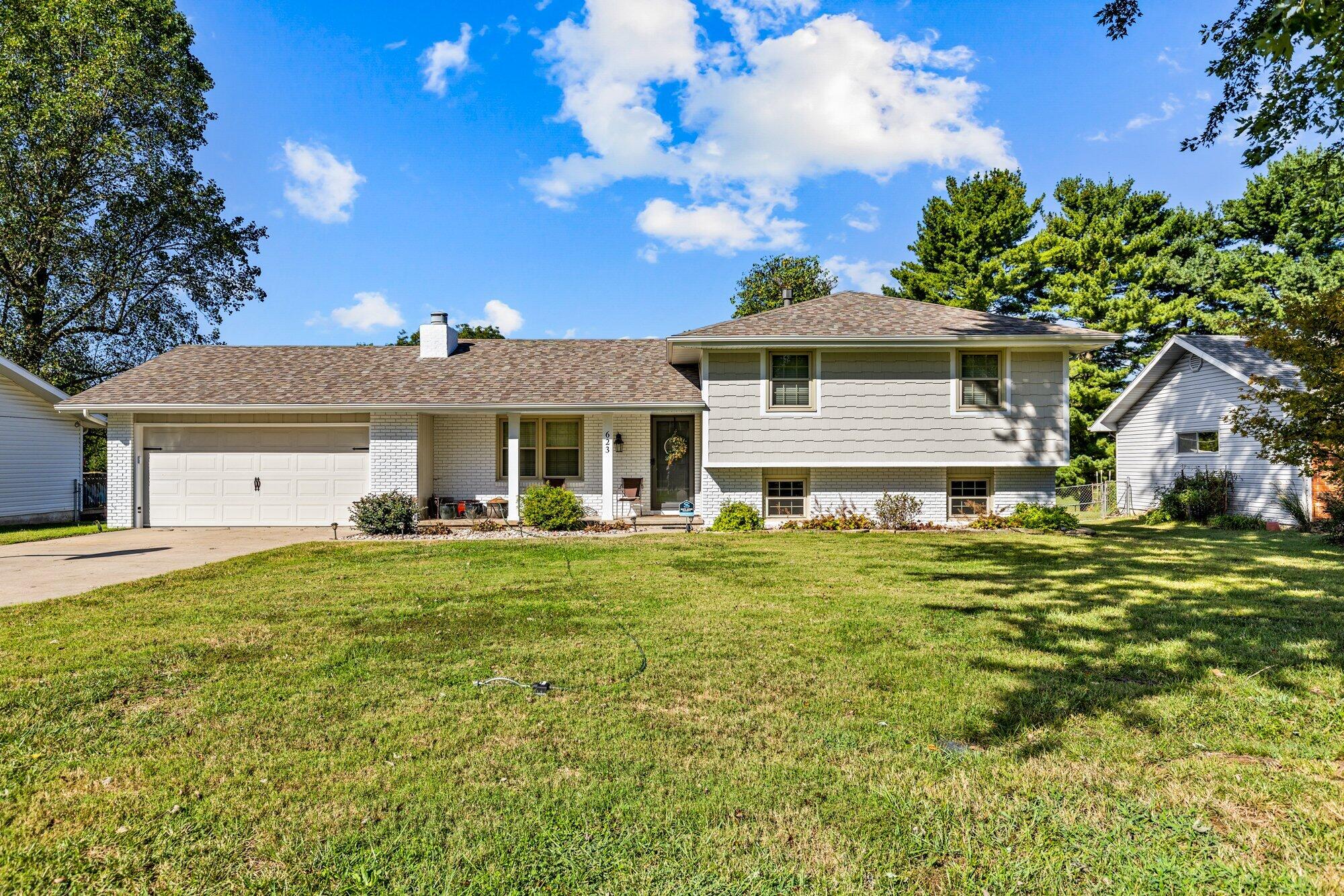 Welcome to your dream Craftsman Style Home in desirable Republic MO.  This beautifully updated 2-story split-level home offers 3 bedrooms and 2.5 bathrooms. This property has been meticulously maintained and thoughtfully renovated, blending classic charm with modern upgrades.Key Features and upgrades include a new roof in 2021, a complete new chimney in 2021, and new gutters/downspouts in 2021. A complete exterior upgrade was done on all four sides.  The front brick was painted and added vinyl on the other three sides. A completely renovated hall bath was updated with new cabinetry, a deep soaking tub, tile flooring and tile above the shower. It is also equipped with granite countertops and a Bluetooth-compatible exhaust fan for added entertainment. (They thought this would be fun). New hot water heater, interior fully painted. The garage has been fully gutted, rewired, brought up to current code with new  additional outlets, drywall, baseboards, fresh paint, and a new garage door opener with keypad. The garage is both heated and cooled for year-round use. There is new flooring throughout. The bedrooms boast new carpet, while the rest of the home features stylish vinyl plank flooring.The master bath feels like a real retreat. It has been remodeled with tile flooring, sliding barn door, new cabinetry with granite countertops adding that luxurious touch. New HVAC system with a Nest thermostat installed for added comfort and new windows throughout, which includes a new sliding door, for energy efficiency. Beautifully redone flower beds and an open space behind the home that ensures no future development--perfect for privacy and tranquility. It is the ideal location. It is  walking distance to Republic's Aquatic Center and local amenities. This home is move-in ready with modern conveniences, perfect for families or anyone seeking style and comfort in Republic, MO! Don't miss out on this gem!