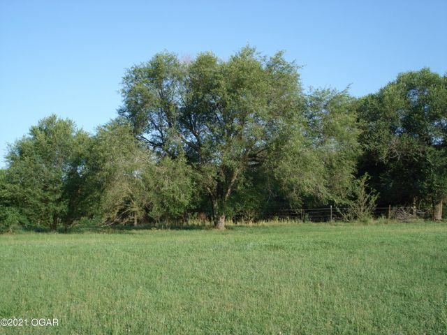 Up to 65% financing available. 120 Acres of Quality Life awaits you. Wildlife and beauty abound. Two springs. Deep well. Love the pasture and the cover of the forest.   120 Acres of Spectacular Property.. Century old hardwoods, Beautiful Pastures. Several Fantastic home sites to be had. Little brick house, electric, well, septic. Priced Right.