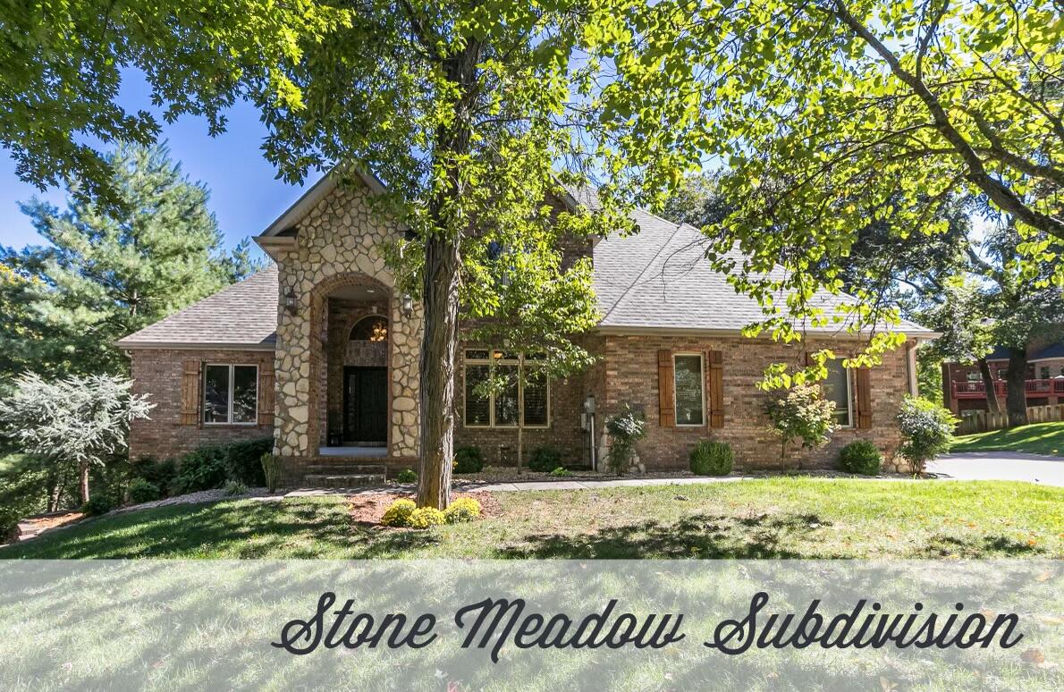 STONE MEADOW SUBDIVISION! Welcome home to 984 Valley Way! This all-brick, custom-built, one owner home is nestled on a cul-de-sac on almost a 1 acre lot in the gated community of Stone Meadow. Upon arriving, you will notice the curb appeal right away with its beautiful landscaping and gorgeous stone accented front porch. Once inside, the entryway leads you past the office into the living room where you will find a gas fireplace with built-in cabinets on both sides of it. The living room flows seamlessly into the kitchen that features solid wood cabinetry, granite countertops, and large kitchen island. The eat-in kitchen sits below large windows bringing in an abundance of natural lighting. Through the kitchen is the formal dining room where you will find more large windows and a double glass door that provides optimal lighting as well as access to the covered deck that overlooks the park-like backyard with mature trees. Upstairs, you will find the spacious master suite with its own personal balcony. It has an ensuite bathroom that features a jetted tub, walk-in closet, walk-in shower, and dual vanities. 3 more generous sized bedrooms and a full sized bathroom will complete this floor. Downstairs, there is another large living area with a beautiful stone fireplace, large wet bar, two additional bedrooms with a full sized bathroom, and a HUGE storage room. Enjoy the peace and quiet sitting on your back deck as this house backs up to a wet weather creek with no neighbors behind it. Conveniently located just a walk away from all that the Stone Meadow community has to offer such as walking trails, swimming pool with a hot tub, tennis courts, basketball courts, sand volleyball, and a pickleball court. You will want to see this home in person to truly appreciate what all it has to offer. Call today for your private showing!