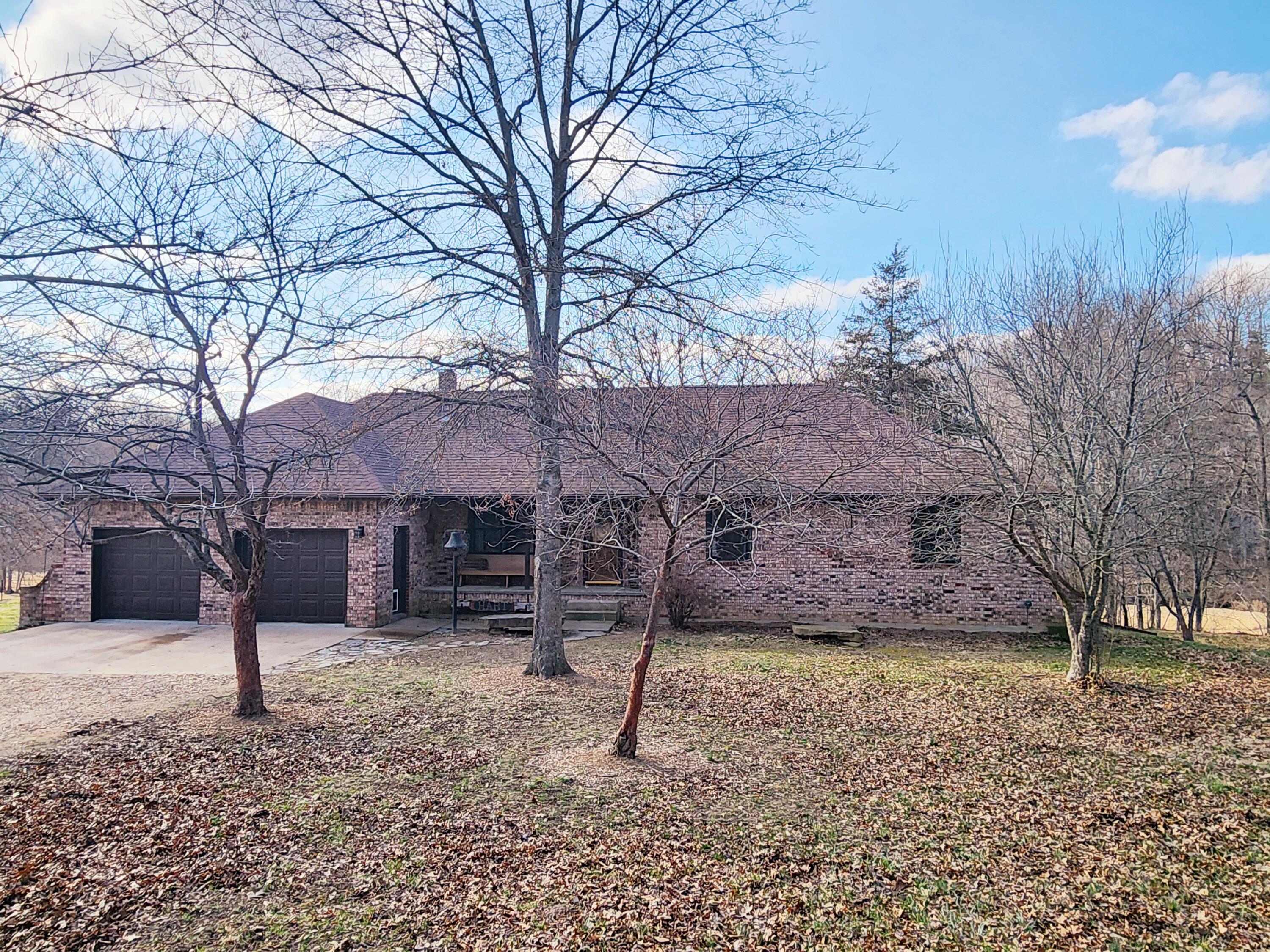 Rare opportunity Ozarks Mini farm with live water, this stunning 11.05 acres offers walk-in access and Piney River frontage with stunning rock walls to look at. Immaculate full brick, metal roof, main kitchen has custom cabinets, wood floors, breakfast area, pantry, built-ins, formal dining wood floors, master suite w/ bath, major updates in recent years, laundry room w/1/2 bath, 3 Bd up, 2 Ba down (non-conforming), 3.5 Ba, Basement, sauna, Full kitchen and living quarters walk-out basement, fully finished, major storage, dual heat, two car attached garage with shop area, front covered porch, back deck overlooking the river, covered patio, landscaping, woven, panel fencing, 4 bay machine shed, 14'x22' shed, 16'x28' horse stalls, shop w/ loft, lean-to, 3 auto-waterers, located short drive from three rural towns, hospital, golf course, peaceful, beauty surrounds this stunning property. Fishing, floating and gigging, horseback riding enjoyed on miles of surrounding gravel road. Own a part of the Ozarks! Let's take a look!