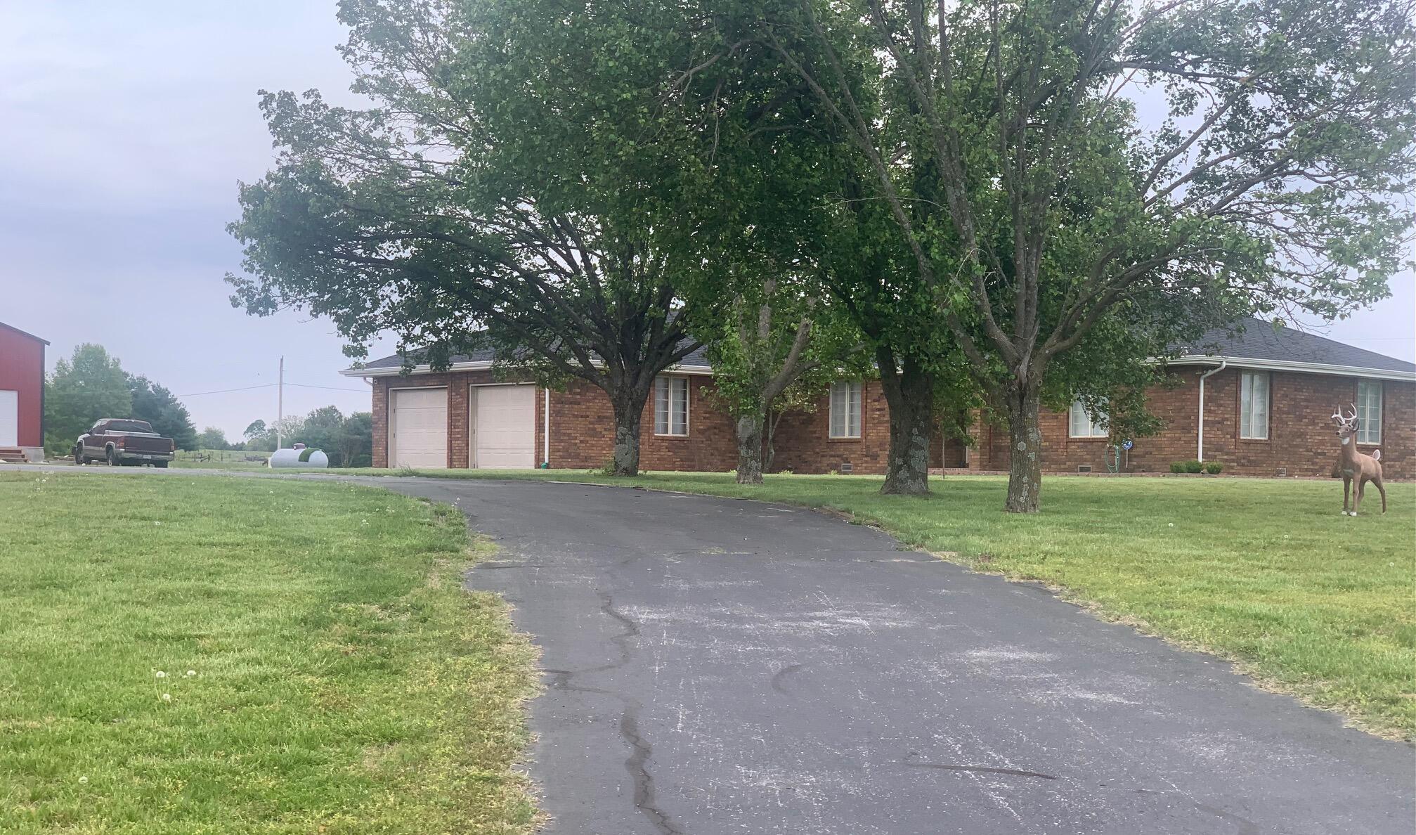 Make this your hobby farm, Home has 4 br, 3 baths, open concept Kitchen/Living, Huge living area, newly remodeled, lots of storage, plus the outbuilding has a apartment with kitchenette 1 1/2 baths, and a 1 car garage., this property also has a 30x48 Barn/machine shop w/concrete floor and electric, it is approx. 1 yr old. Greenhouse, fruit trees, blackberry and raspberries, grapes.
