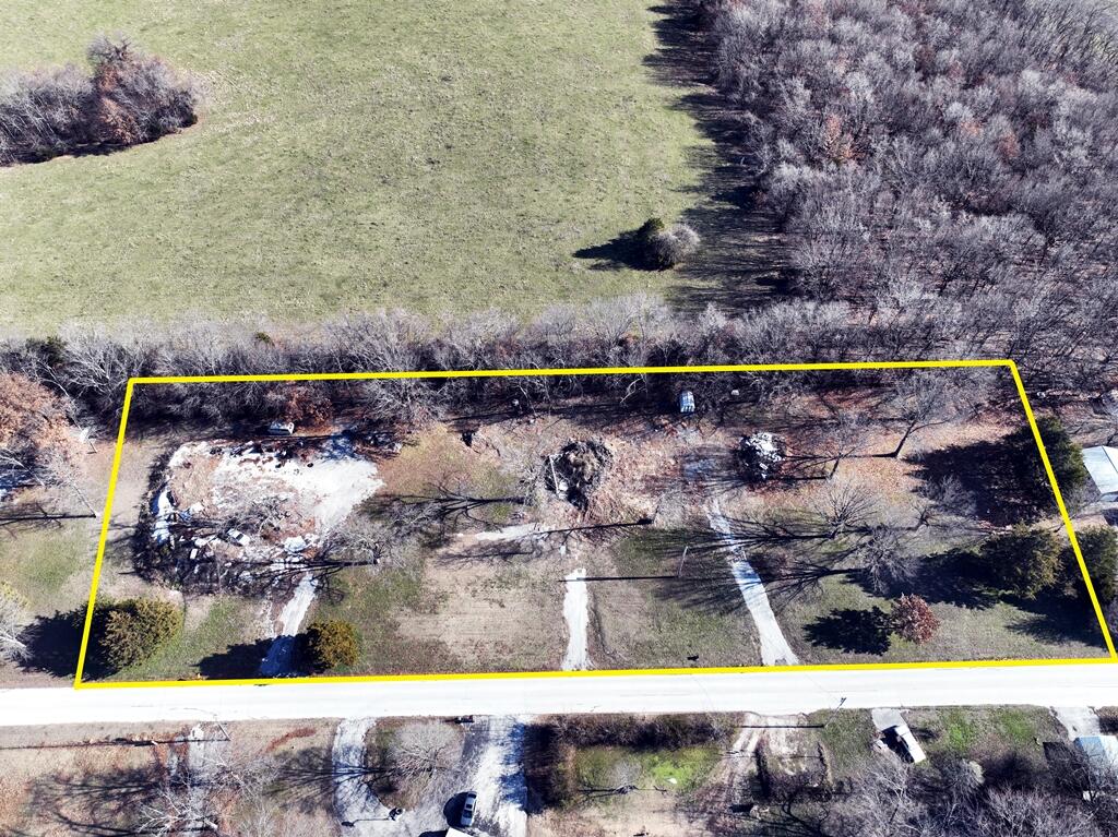 Incredibly rare 2.06 acre lot in the middle of Ozark. This lot is considered to be outside city limits while still being in the city. This lot is located in an amazing location less than 2 miles from the new Johnny Morris ''The Ozark Mill at Finley Farms'' and river walk. The Chadwick Flyer Trails will be in walking distance once it is complete. It is currently being built and is said to take you all the way to Springfield. You have so much diversity in what you choose to do with this lot. you can put a mobile home, build, or even use it for agriculture and live stock. The View of the sunset and sunrise are also something to note. This is a rare opportunity. A portion of the lot is already paved for a mobile or shop. There is also a partial foundation left from a home that was burnt down.