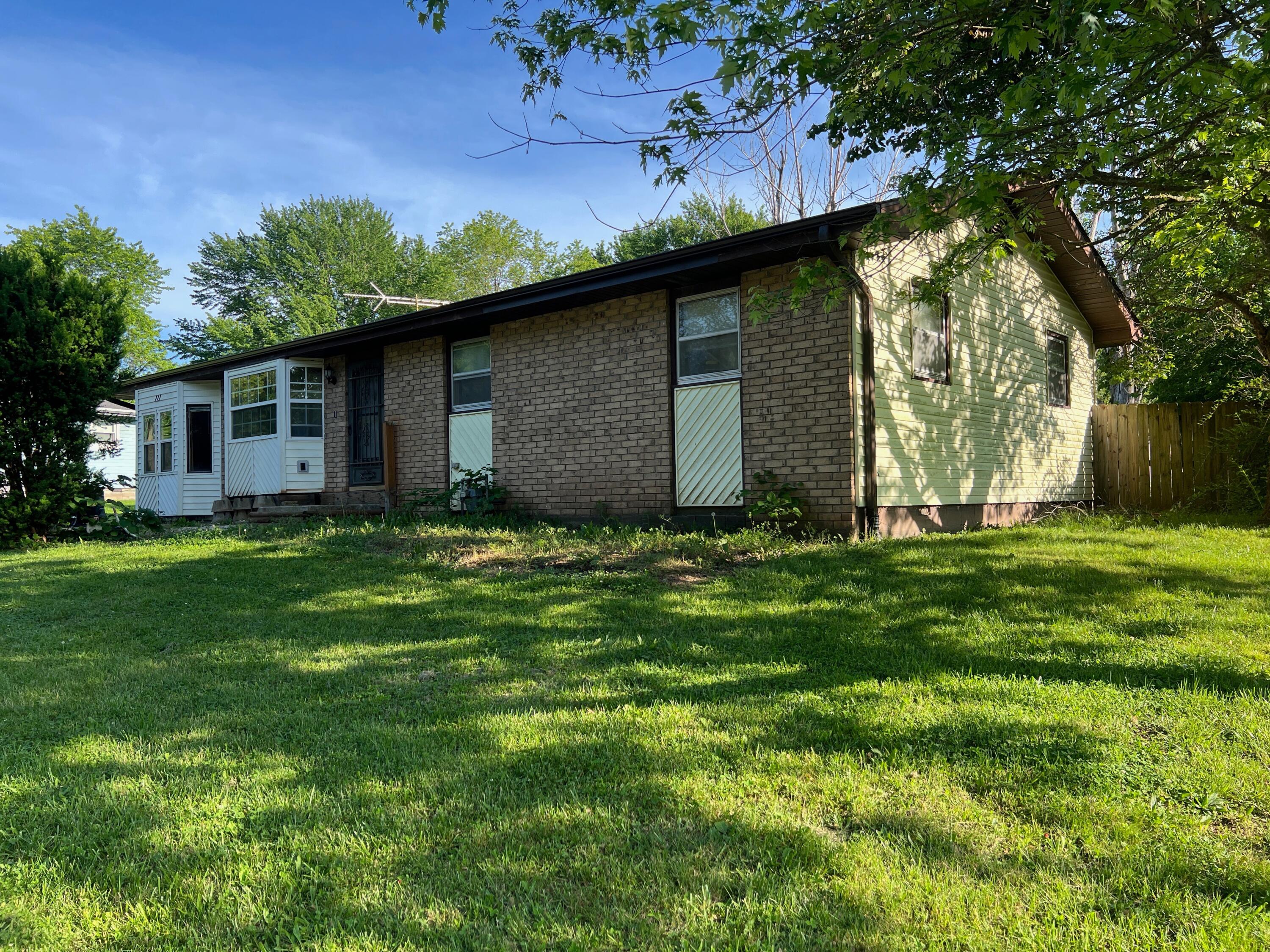 With some TLC this fixer-upper has tons of potential. Hard to find a shop building of this size and price in Republic!! 4 bdr, 1 bath home w/1420 sq ft w/a split floor plan. Large backyard w/a 2 car detached garage/shop. The workshop has electric & has a separate office/storage room. The 1 car garage has been converted into a master bedroom w/a bonus room that can be used as a large walk-in closet or an office area. Another creative option for the 9'x5' bonus room would be to transform it into a master bathroom.  Home has a New ROOF as well as a large backyard to hang out in. Home is being sold AS-IS.