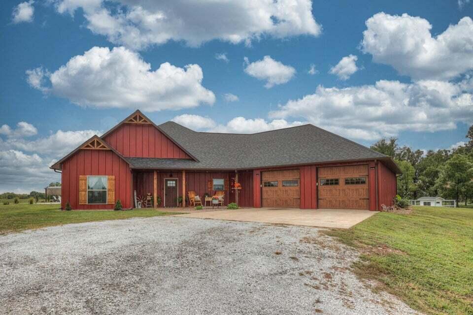 Are you looking for country living at its finest. 9.25+/- acres, metal home with a large in-ground pool and outdoor kitchen. Custom built cabinets with showcase glass adorn this open concept kitchen. Large walk-in pantry and 9 ft. ceilings that will make your jaw drop! Solid interior wood doors throughout the home and tons of built-in storage walls. Property also features a large 3 bay pole barn and a custom heated and cooled dog kennel and large dog runs. A covered patio off of the primary bedroom for those peaceful morning cups of coffee. Call an agent today to see this beautiful property!!