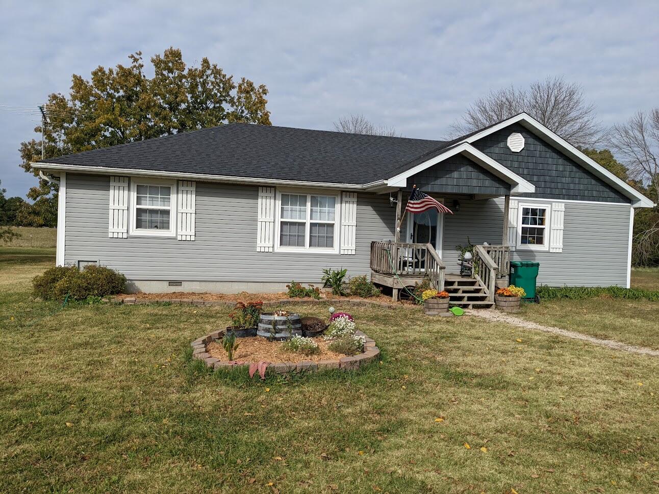 MOTIVATED SELLERS! Enjoy the privacy and scenic view!  Located on a paved state highway just 5 miles from town, this attractive newer home has numerous updates, and is move in ready. New siding (with added insulation), and roof in 2020, metal 2 car garage with concrete floor, electric and workshop area in 2019, Heat pump HVAC, and all new interior doors. Other features include a jetted tub, new tub enclosure, new hot water heater, and a full set of stainless steel kitchen appliances. The seller reports low energy costs. The property has been surveyed, fenced and cross-fenced with welded pipe corners.