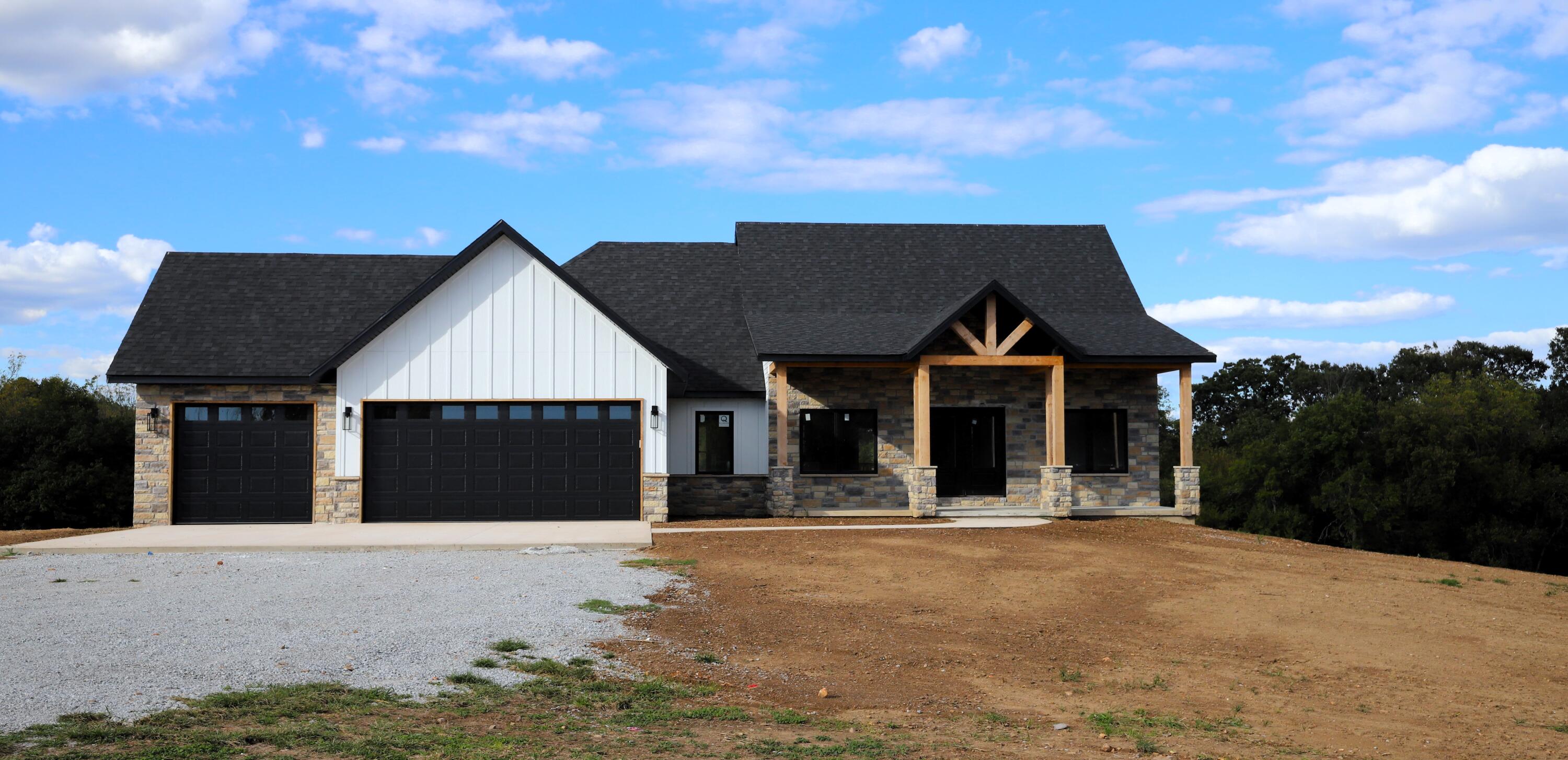 New construction on 8 acres just outside of Clever built on a larger family parcel with a gorgeous view of the countryside.  This farmhouse style home welcomes you with an oversized front porch and has 5 bedrooms and 3 bath with a walkout basement and additional separate office space.  Over 3500 square feet with 2 living spaces and open concept floor plan with custom built kitchen, large center island and walk-in pantry. When you enter the house through the 3-car garage, the mudroom provides that added space to kick off your shoes.  The laundry room conveniently adjoins the mudroom and master walk-in closet on the other end. The views from the back deck are breathtaking and you will likely see some wildlife nearby. More Pictures will follow !!!