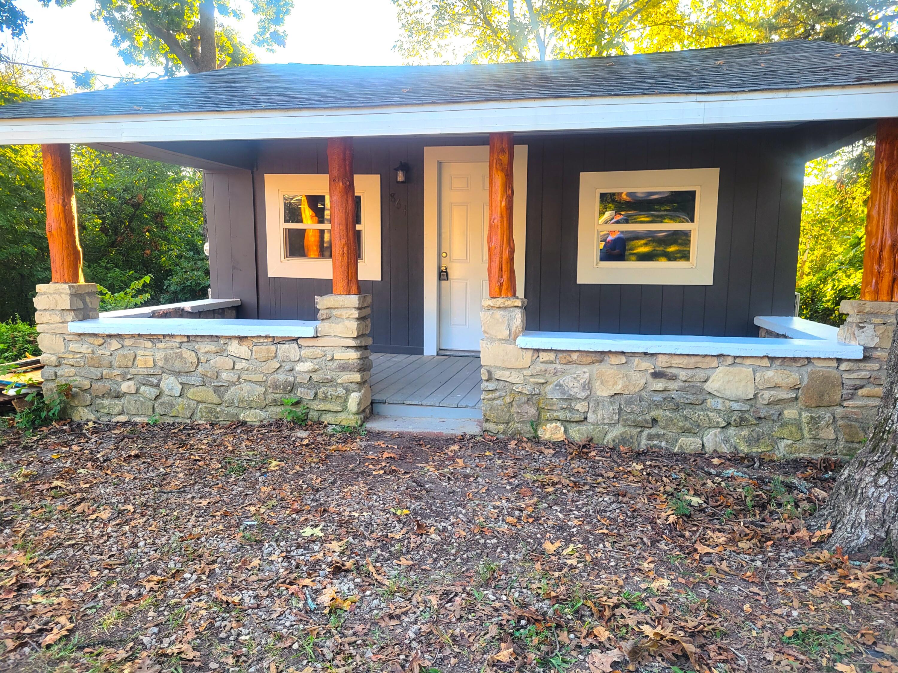 Are you looking for the perfect vacation or starter home that is affordable and move-in ready with a great location? Stop looking because you've found it! This cozy, stick built cottage sits on a double lot located less than 5 minutes from the Branson Landing and some of the best restaurants and shopping in the area. This historic home has been updated with fresh paint, new roof, new mini splits, new windows, new water heater, and new flooring. When you are not enjoying the nearby lakes and Branson entertainment, you can BBQ on your expansive back deck, or watch the world go by on your large covered front porch. This gem of a house truly has a lot to offer. The seller is even including a home warranty! Schedule your showing today, this home will not last long!