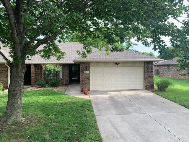 About 1,500 sq. ft. (per assessor) in this well kept 2 bedroon, 2 bath, all brick patio home in Southvale Terrace.  Conveniently located on a cul-de-sac street between Cox South Hospital and Battlefield Mall.  Remodeled  kitchen has newer cabinets, stainless steel refrigerator, built-in microwave and breakfast bar.  Hardwood floors.  Great room has gas log fireplace and built-in bookcase.  Both bedrooms have plantation shutters and larger walk-in closets. Remodeled master bath has step-in shower and double sink vanity.  Garage has separate sink for washing hands.  Screened porch has great view of backyard with beautiful flowers.  Privacy fenced yard.