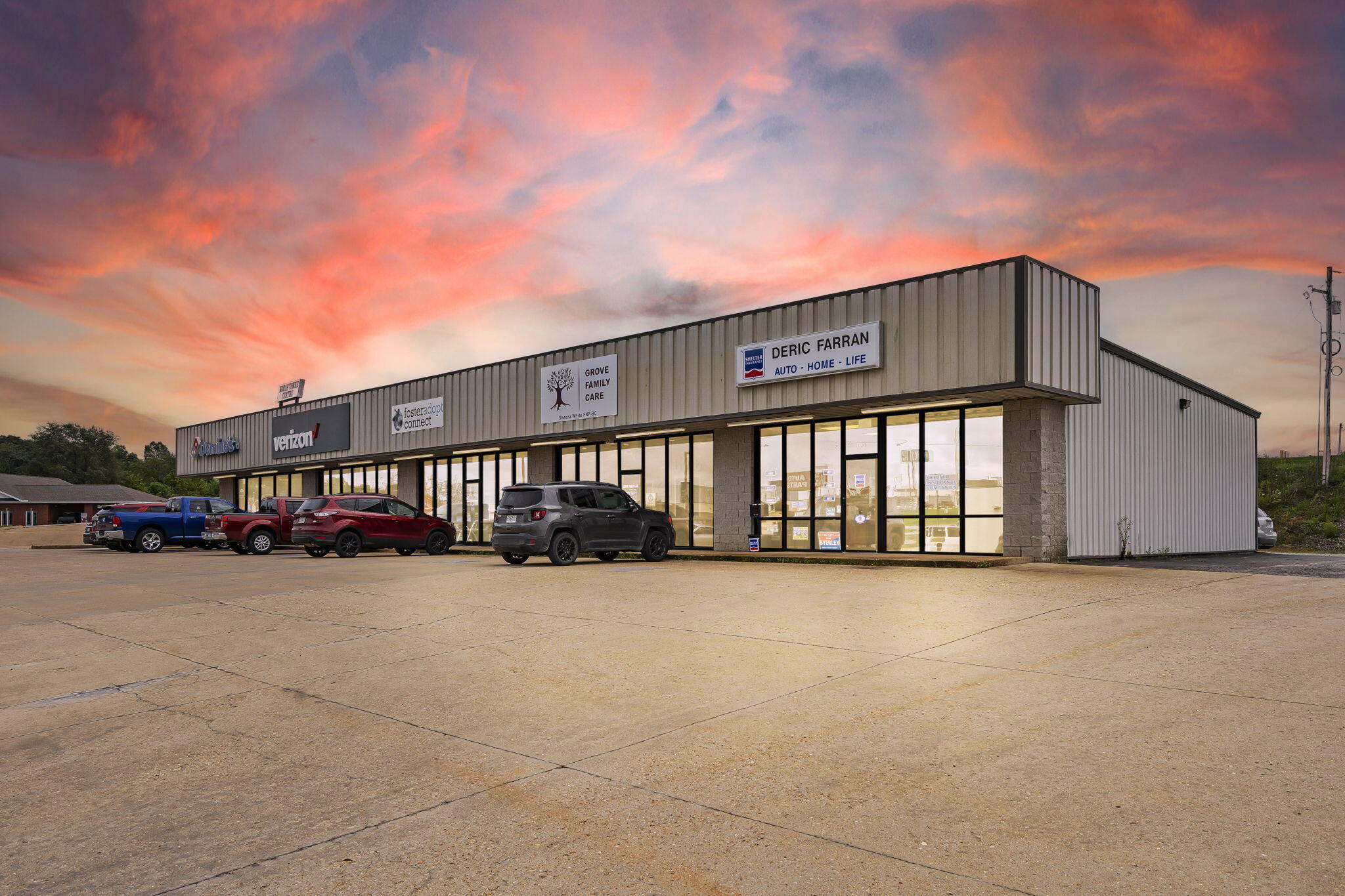 This 6500 square foot commercial building is located on the busiest retail corridor in Mountain Grove, offering excellent access and visibility. Situated on 1.25 acres , there is room to grow. This well-maintained property features a metal roof. The property boasts a strong tenant mix, including Domion's Pizza, Russell Cellular/ Verizon, Foster Adopt Connect, Grove Family Care { health care provider} and Shelter  Insurance. Tenants have been in place for several years, Also has a tenant on a wait list for an opening, ensuring steady income.The building also includes a large concrete parking lot, making it convenient for customers. Excellent investment opportunity in a high-traffic location!