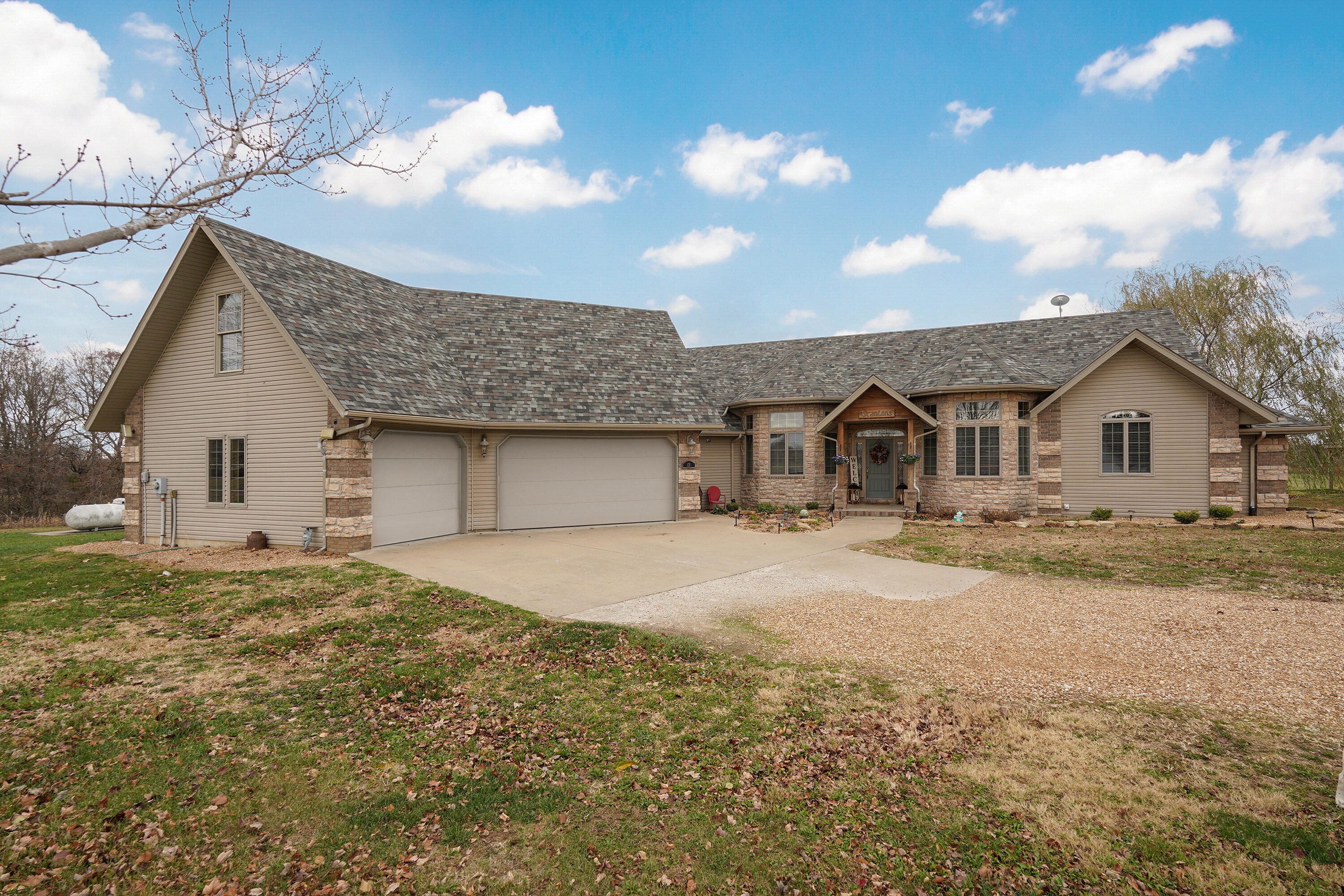 Custom built home in ROGERSVILLE schools on 5 acres with 30 x 50 shop with an apartment!  Main home offers 3 bedrooms on the main level, Formal dining, Office, Large living room with stone see-through FP to hearth area. Kitchen has Kitchen-aid double ovens, Viking gas range(also plumbed for electric),Granite, Maple cabinets, 2 built in hutches & pantry. Master suite offers 2 walk-in closets, jetted tub, separate sinks and walk-in shower. Half bath on main level for guest. The other 2 bedrooms have a jack n jill bathroom. Upstairs is the 4th bedroom or 2nd living area, wet bar, private deck and bathroom. In-ground pool 16 x 34 put in by Dougs Pools, 3.5 ft -5.5ft with sunbathing ledge, Covered patio, Gazebo, Roof 1 yr old, Anderson windows & a workshop room in the 3 car garage!! Shop has an apartment that is a 1 bedroom, full bath, kitchen and living area. Super cute with tin ceilings and concrete floors, also Handicap accessible. Wrap around porch, Dog washing area, very well built and insulated.  All appliances in home and apartment stay.  17 mins to Springfield.Truly a must see!