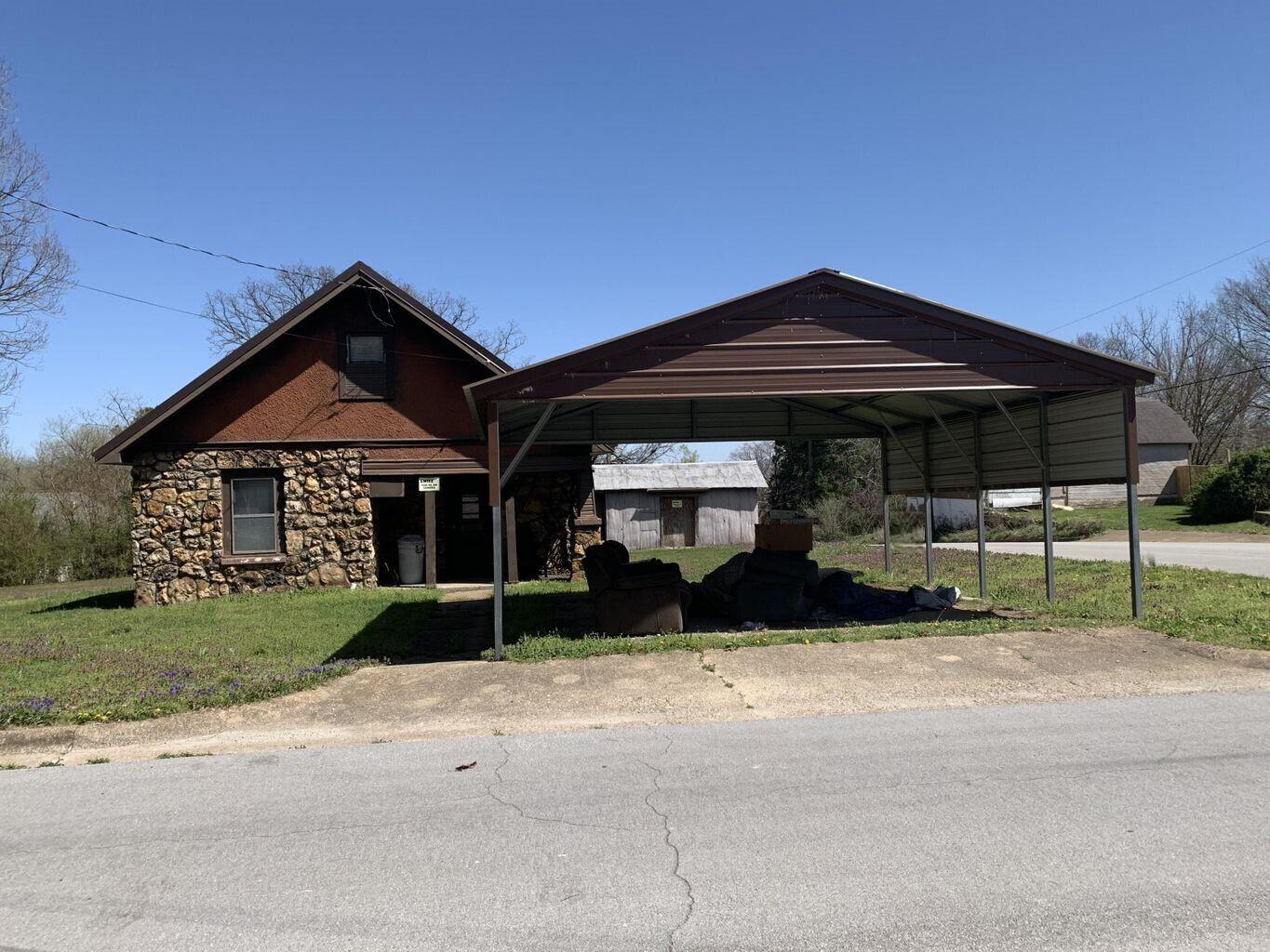 INVESTORS!!  LOOKING TO FLIP??  This home needs lots of TLC but sits on over 1/2 acre in town.  Room to build additional home(s).  House has great bones and new metal roof, new carport and older outbuilding.  Priced to ensure great return for you!Owner financing available.  Terms TBD.