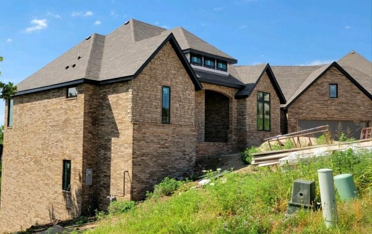 Brand new in Rivercut! Located in a cul-de-sac with views of golf course and valley. All brick/stone exterior with a lighter shade wood flooring planned for living room/kit/din/entry and hallways of main level. Beautiful cabinets and Quartz countertops, Black fixtures and hardware, fireplace on the main level. 3 BR's on main level with 2 additional in basement. Generously sized wet bar in basement. Family room in the basement will have fireplace. Stainless appliances with gas range& walk-in pantry in kitchen. Full sod, & irrigation .