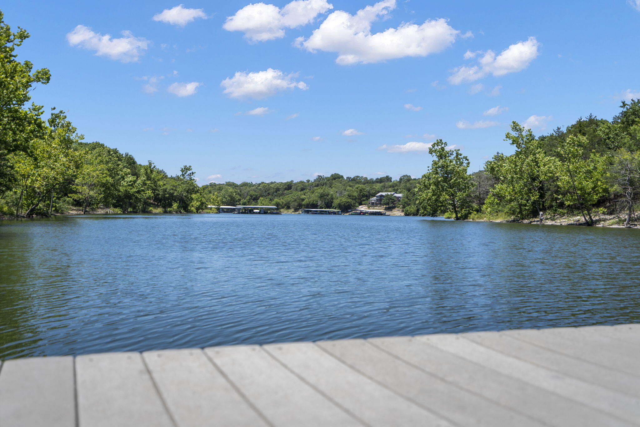 Extremely Rare Find on Table Rock Lake! Grandfathered Furnished LAKE FRONT Vacation Rental with a Private 2 Stall Boat Dock included! This 6 Bedroom (2 non-conforming) 3 Bath home has many features to offer, Open Concept, updated bathrooms, John Deer Room, Detached Storage that would make a great garden shed, she shed, shop, or Mancave, wood burning fire place with custom mantel, Large Picture Windows that show off the Ozark Mountain Views,  sits on 1.4 Acres of Ozark Mountain Table Rock Lake frontage with many amenities guest have enjoyed over the years, firepit, large double decks for grilling and entertaining, game room, swimming platform, and more. The private dock includes fish cleaning station, picnic table, swimming platform, slips are 10x24 each. Adding this already successful Vacation Rental to your portfolio? There are some great opportunities to increase the revenue even more by adding some more private amenities, for example converting the John Deer Room to a Theater Room, Adding Infar Red Sauna, Private Pool or Swim SPA, add a splash of color and some murals!  Live your best Lake Life Today, great investment opportunity, second home, or even a prime full time Lake home.