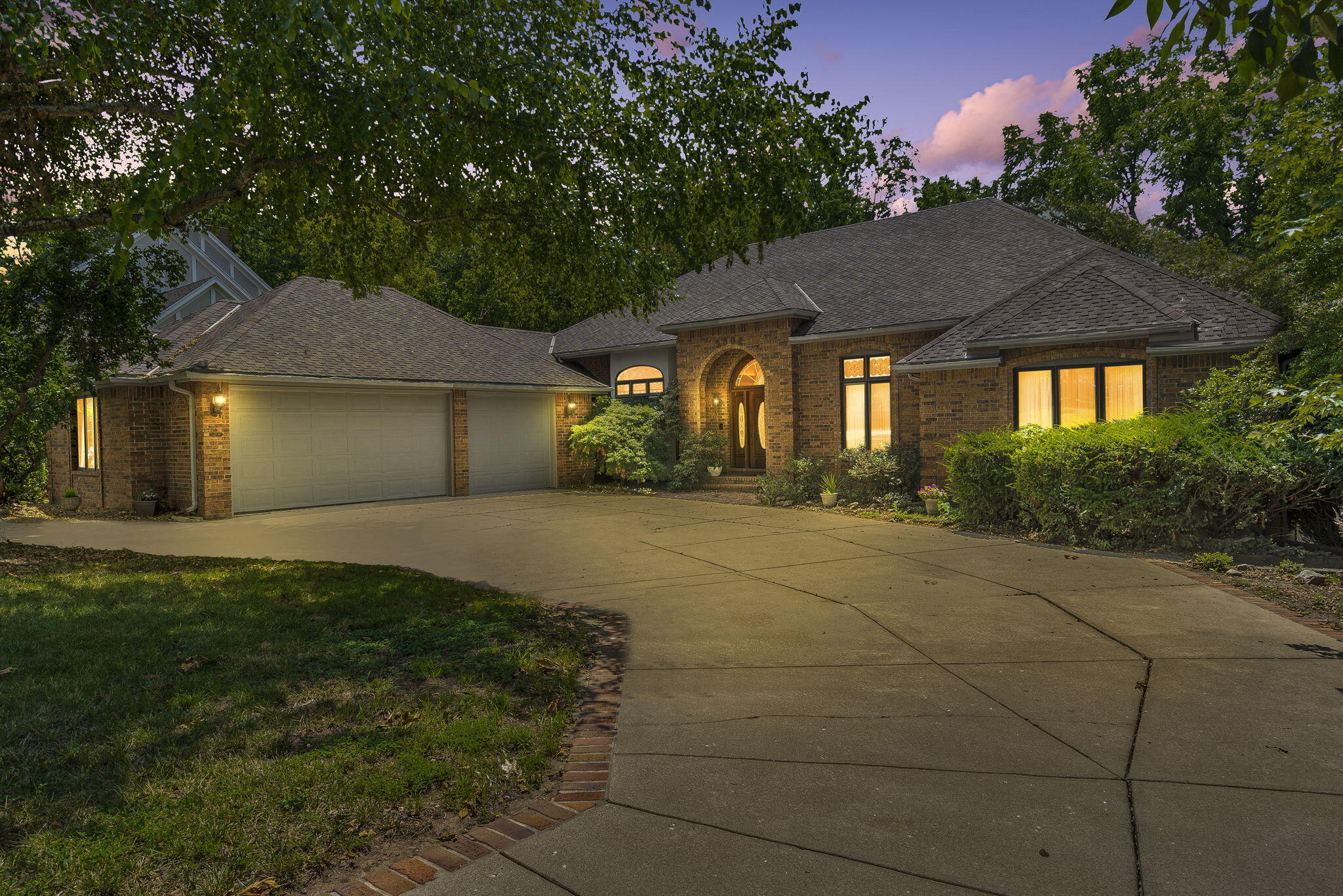 Step inside this one of a kind home backing up to Lake Springfield Park in the Ravenwood South subdivision. Built in 1990 by James Foster the jaw dropping 38 foot long foyer with rounded birch barrel ceiling, brass trim and decorative lighting will take your breath away. The arched doorways, beautiful wood features and impressive detail throughout showcase an architect's dream project overlooking a true, park setting backyard. Just off the front door you will find the library with rich wood accents and built in shelving. Around the corner the private master wing offers an expansive bedroom, dual walk-in closets, dedicated office or nursery and spacious bathroom. On the opposite side of the home features an impressive living room with 12 foot ceilings, a wall of windows over looking the park and a wet bar for entertaining just across from the formal dining room. The kitchen provides an eat-in dining space, laundry room and half bathroom just off the 3 car garage. Travel downstairs to a walkout basement oasis designed for entertaining at the 13 foot long bar or gaming area with pool table included. This expansive room also allows for a poker or dining table and a lounging space centered around the wood burning fireplace. Down the hall are two additional bedrooms each with their own private full bathrooms and lots of storage. The unfinished room could be converted to another bedroom with an egress window already in place or a personal workshop. This pristine, time-capsule home has been well maintained by just 2 owners over the past 3 decades. The craftsmanship, location and quality of work makes this home truly one of a kind.
