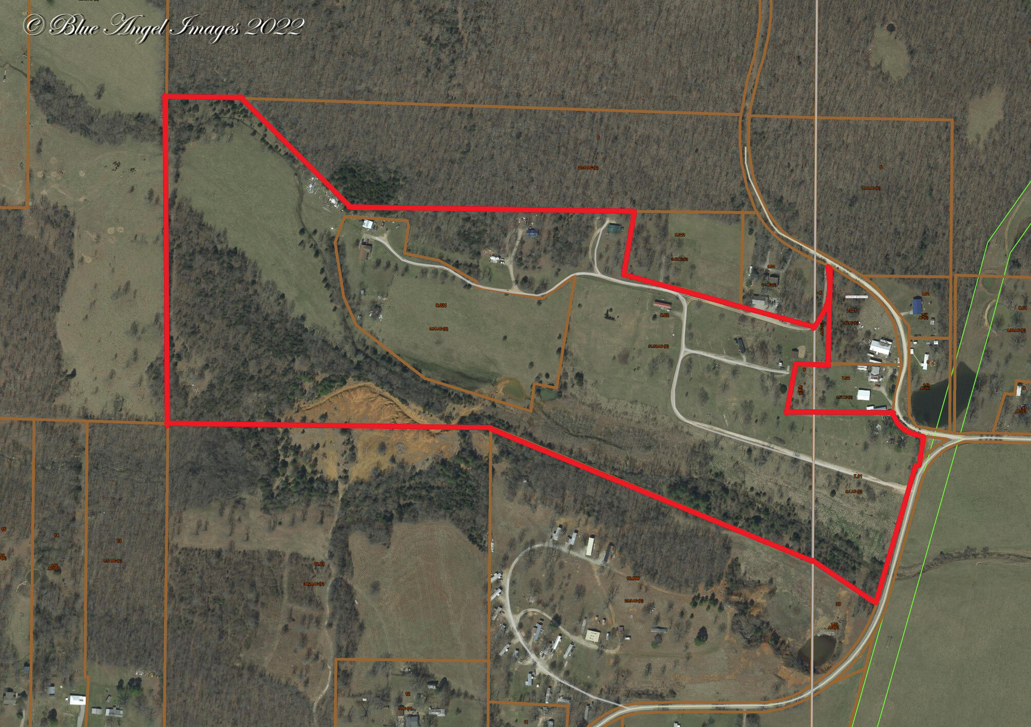 Endless Possibilities! This unique 68-acre parcel is located just outside of West Plains City Limits. Complete with a PRIVATE single level, 3 bed 2 bath home, 7 rental properties that generate $2,900/month, cattle tight fencing x fencing, 2 wells and rural water. This place is ready for you.The family home is situated near the back middle of the property and is surrounded by roughly 40 acres of fenced pasture and woods. If privacy is something you are looking for you have found it. Built in 1995 this 2,300sf ranch style home is ready to go. Another bonus, just outside the home is a large, detached shop with storage area.The front portion of the property, roughly 28 acres, previously operated as a mobile home park. However, THE ENTIRE PROPERTY CAN BE UTILIZED FOR ANY TYPE OF COMMERCIAL OR RESIDENTIAL Development. Ministorage, RV Park, Residential Neighborhood - all good here! Seriously look it over! A private family home with shop surrounded by 40 acres of fenced pasture. Plus 28 acres of ready to develop land that has rural water and is already generating $2,900/month! Do not let this pass you by.