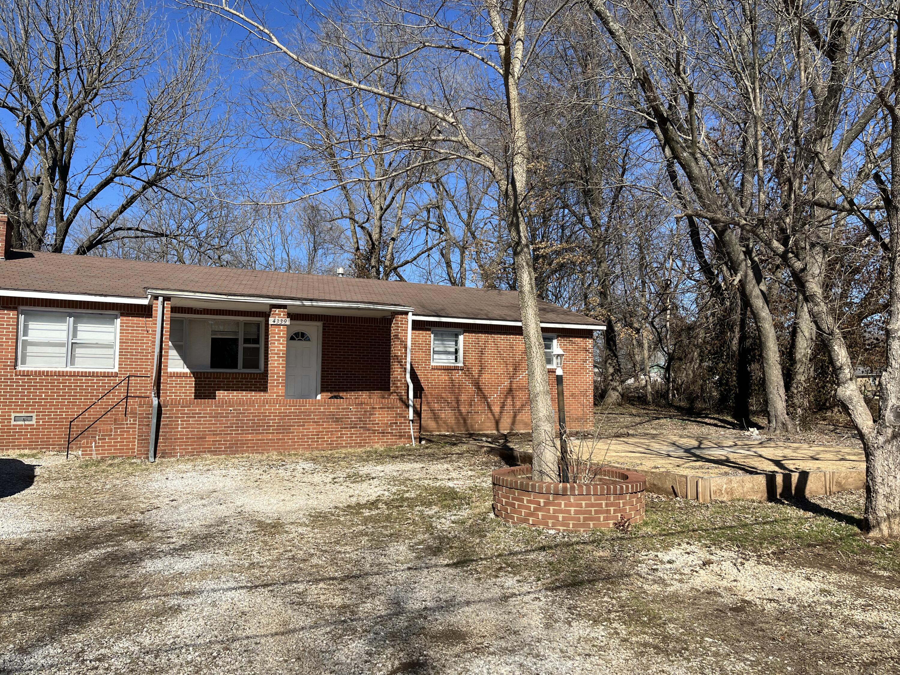 Very affordable 3 bedroom, 1.5 bath, all brick home with wood burning fireplace. Large lot (almost 1/2 acre) with tons of potential. Carport has been converted to enclosed space.