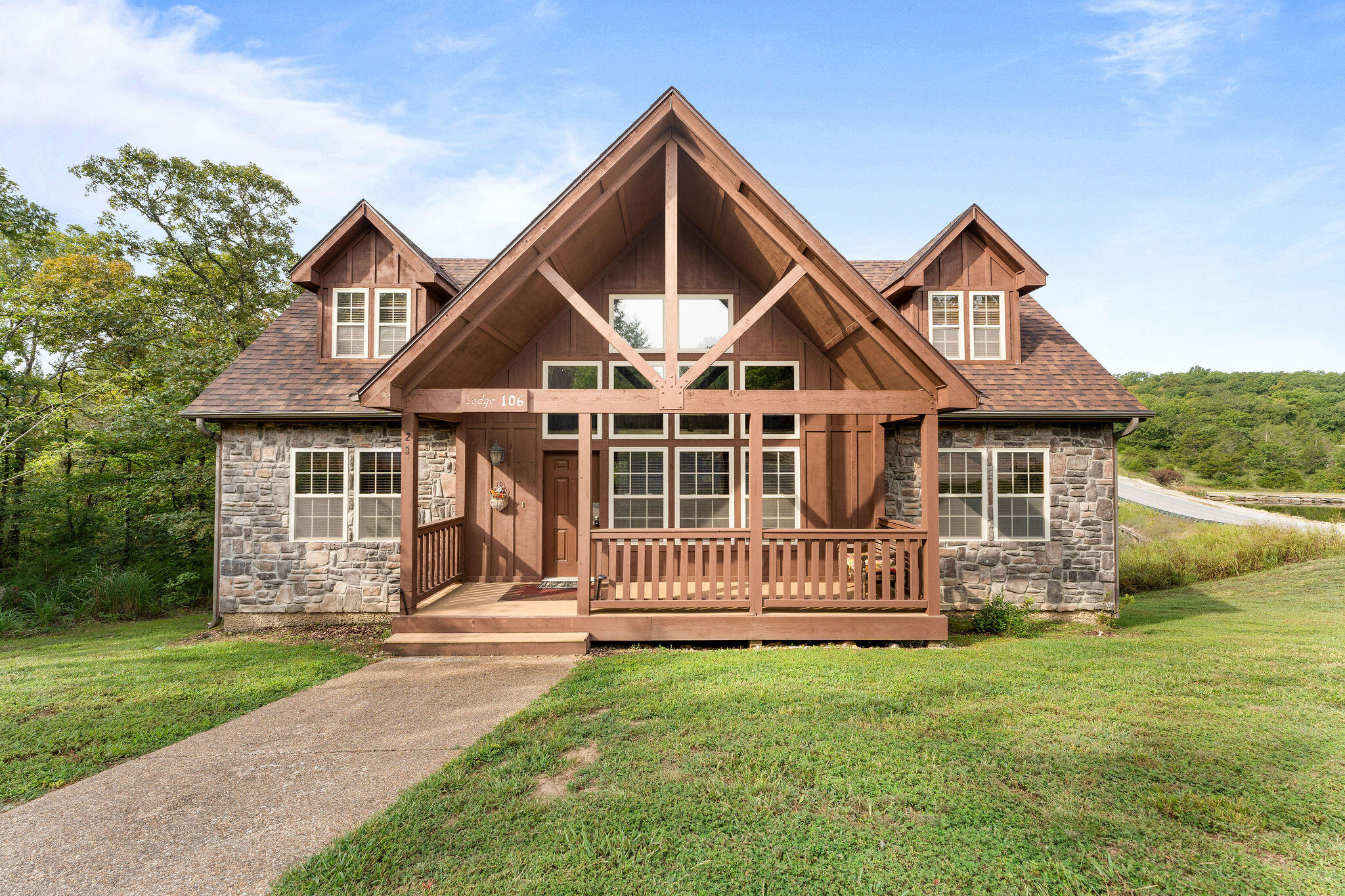 Discover the perfect balance between nature and luxury in this 4-bed, 4-bath lodge located in the gated community of Stonebridge.  This lodge comes with everything that's in it, so it's ready to welcome you and your guests to the ultimate Ozarks vacation, and it's located right across the road from the Pavilion! You can self-manage or choose your own management company. Seller has always used the lodge for family only so it's been lovingly taken care of. There's so much to do right there at Stonebridge that you might not even want to leave! Take a dip in one of the pools and then head over to the golf course for 18 holes. After that you can enjoy a delicious meal at Ledgestone Grille and head back to the lodge for a relaxing evening. Once you are ready to venture out, Silver Dollar City and Indian Point Marina are right down the road and it's only 10 minutes to downtown Branson for plenty of shopping, dining and entertainment!