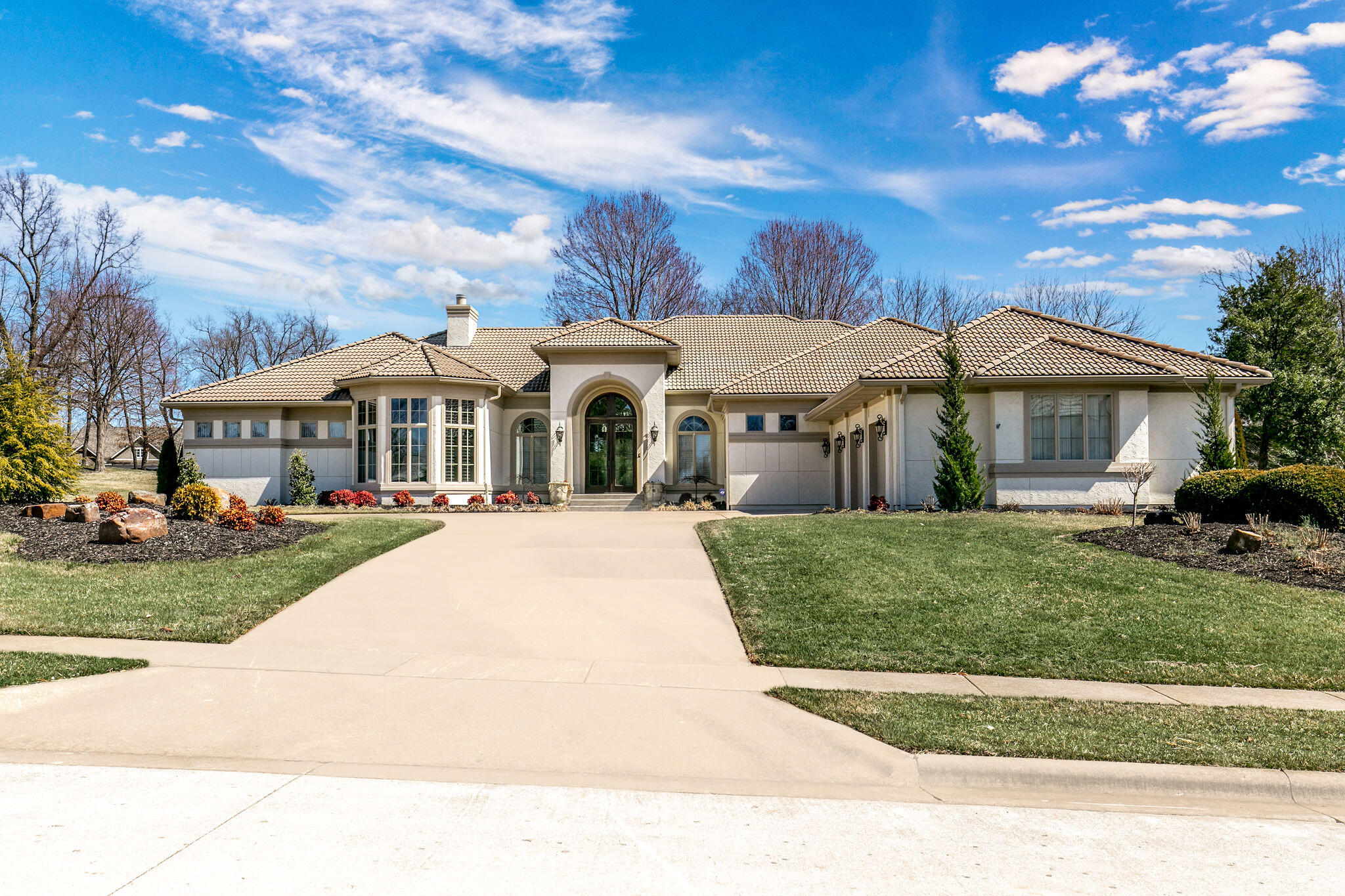 Impressive home located on a prime lot in Highland Springs Country Club, Springfield's only private and gated residential golf community.  Home has been extensively remodeled and features 3 bedrooms, an office, 3 full and 2 half bathrooms, and a 3 car garage.  Walk into the grand living room with formal dining space and office with built-ins.  Remodeled kitchen with marble counters, oversized center island, walk in pantry, wet bar, and 2nd dining area!  Off the kitchen is the 2nd living area with access to the large covered patio.   Master bedroom with tray ceilings, fully updated master bathroom with marble dual sink vanity, marble walk in shower, soaking tub, and walk in closet.  Bedrooms 2 and 3 are their own suites with attached bathrooms and updated with the same care and marble accents.  Large laundry room with ample cabinet space and 2 powder rooms.  New wood floors throughout, freshly painted, and all new appliances in 2017.  Overlooking the 17th fairway on the golf course and in Rogersville Schools.  You do not want to miss this stunning home!