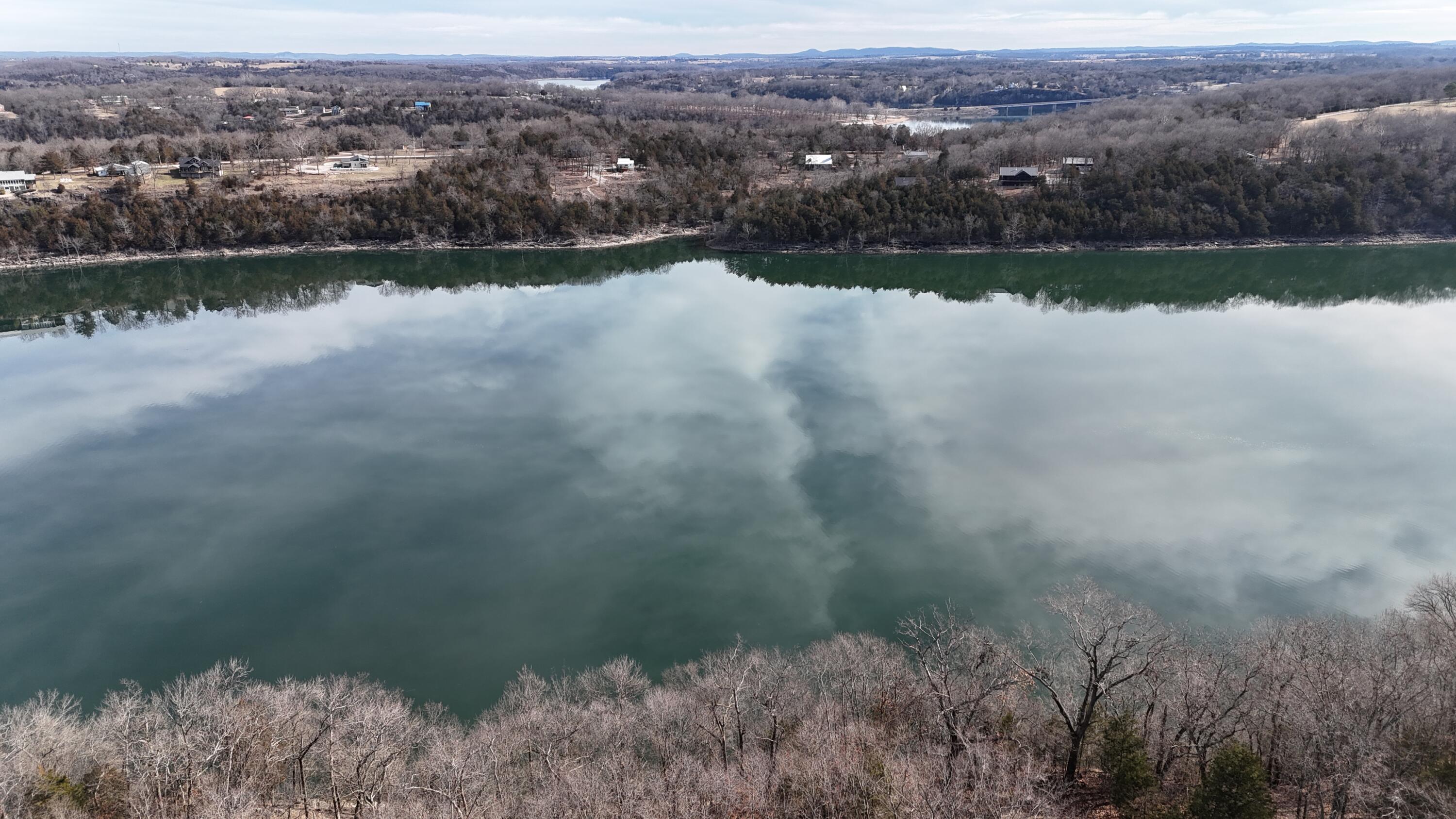 Ready to build upon lots, directly overlooking Table Rock Lake. 2 ideal lots with all necessary utilities. The lots sit upon a bluff providing a perfect scenic view. A builders dream! Accessible to Public boat ramp. Whether you are looking for an exceptional site to build a home or simply a storage location for your boats, this is an ideal location.