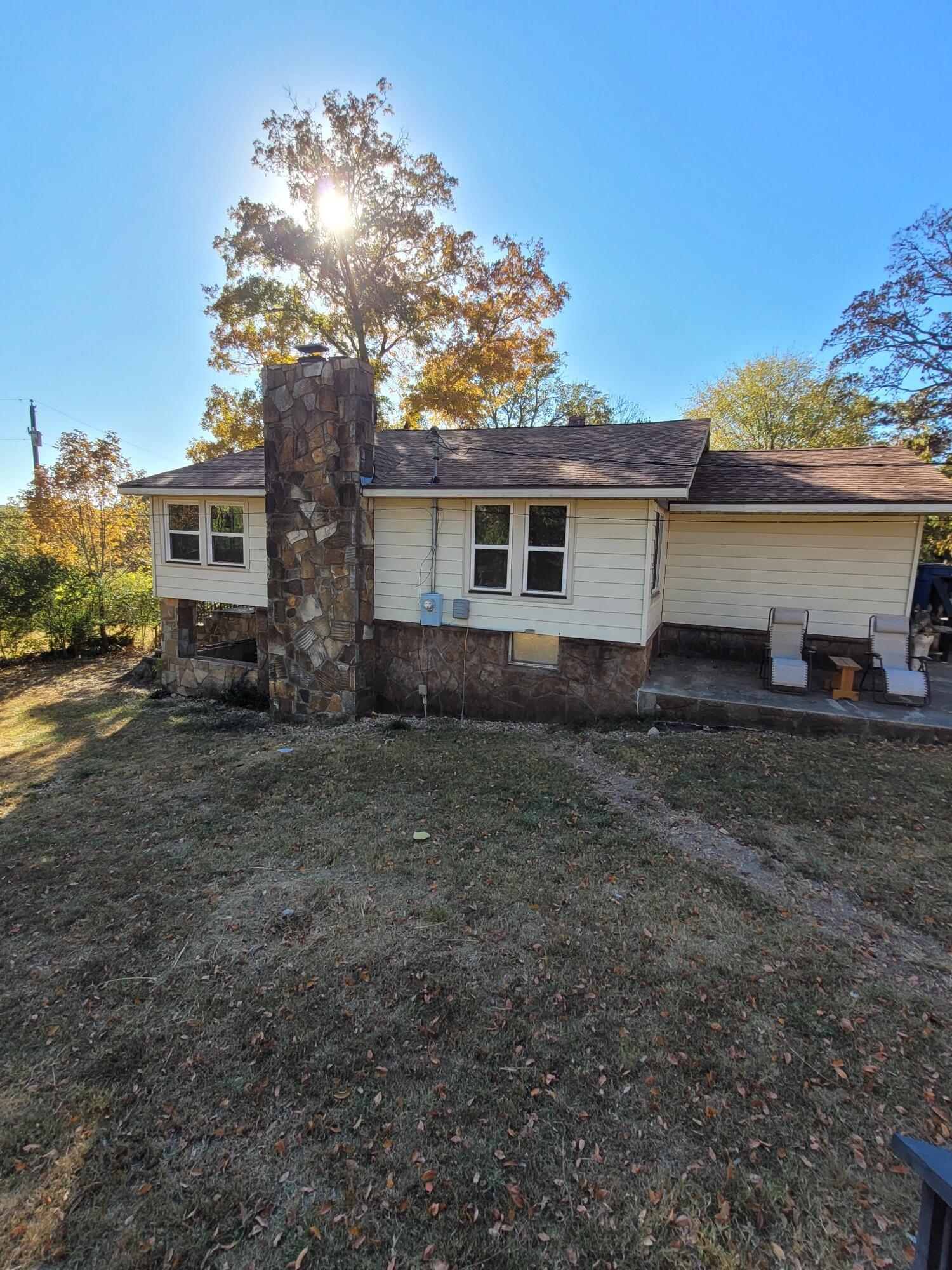 Grab your fishing pole. This property is just a short walk to some great fishing at Lake Taneycomo. bungalow style home on this 10.80-acre Lake view property.The 4-car garage, sheds and pole barn on this beautiful property allows for plenty of storage for the lake toys and options galore. Take advantage of This UNRESTRICTED acreage that is 20 minutes to Branson and within walking distance of Empire Park, walking trail, fishing dock and public boat launch. Come and take a look.
