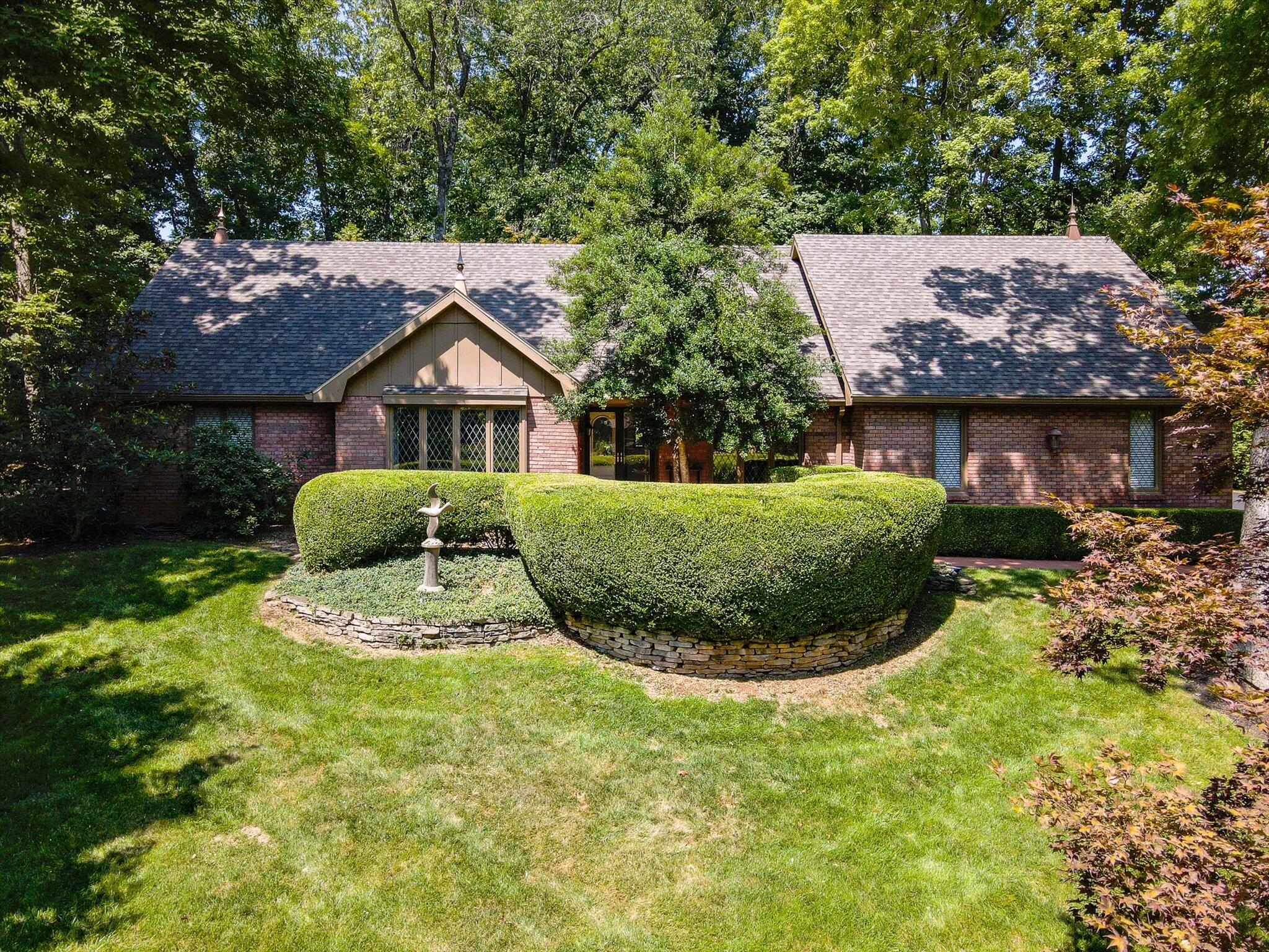 Great Home in Move-In Condition...Ready to ENJOY!! Located in the Highly Desirable Wildwood Estates Subd. by Lake Springfield with a great location just off Hwy 65. This 1.5 Story All Brick Home is loaded with Charm and Character through-out with Open Living Areas, and has the option of having your Primary Bedroom  either on the First or Second Floor! It has an Incredibly Beautiful Landscaped Lot, just under one acre with a Sprinkler System, Privacy Fencing and Multiple Patios for Entertaining...Plus a Greenhouse with storage area for Lawn Equipment!  This Home is a Classic Beauty!!!