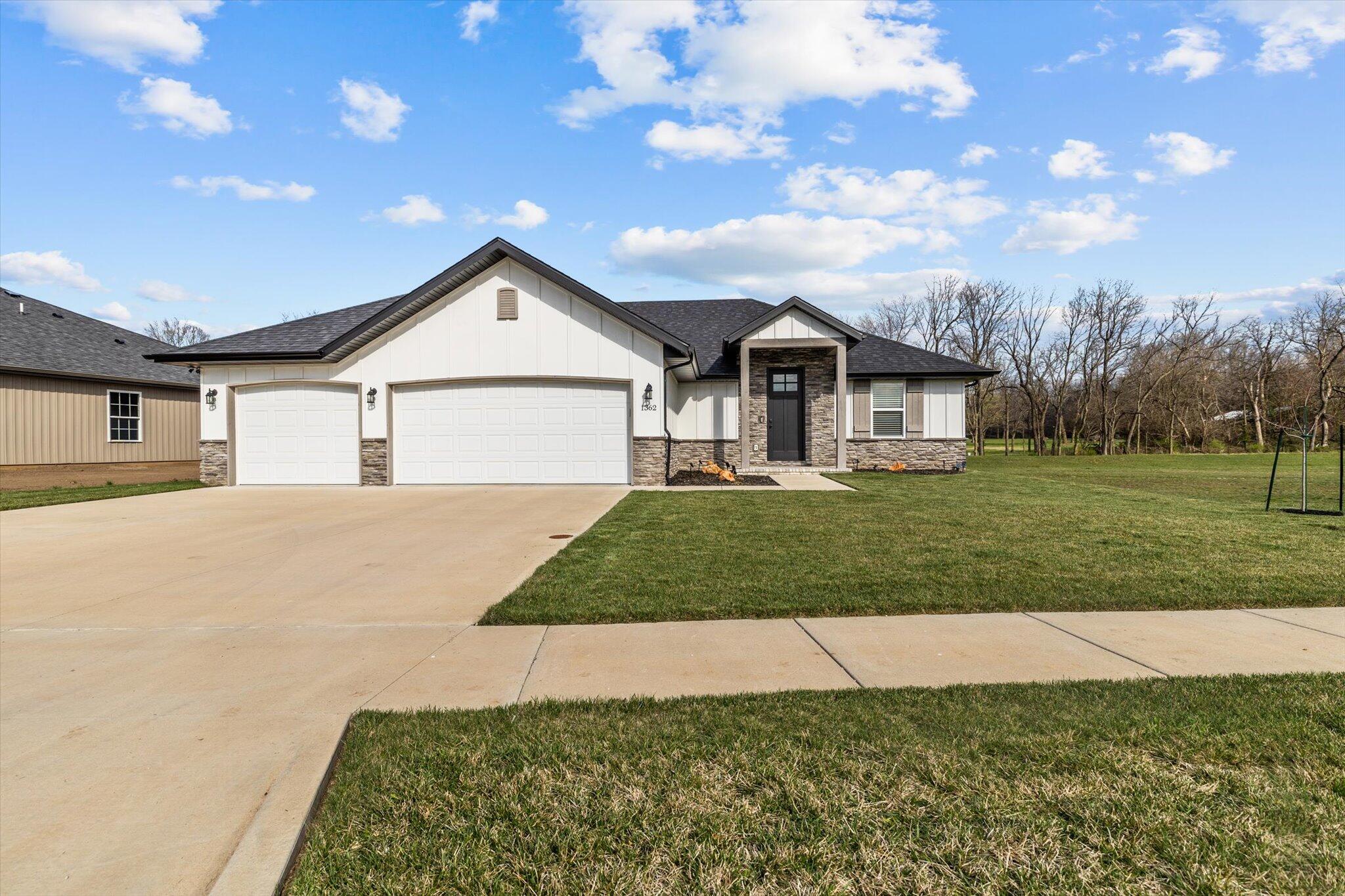 Welcome to your dream home in the prestigious Bent Tree subdivision of West Springfield! This newer construction (built in 2021) offers an unparalleled blend of elegance, comfort, and functionality. Featuring 3 bedrooms, 2 bathrooms, and a spacious 1630 square feet of living space, this residence is designed to impress. The three-car garage provides ample parking and storage space, while the simple yet beautifully maintained landscaping enhances the home's curb appeal.Step inside to discover a gourmet kitchen featuring custom-built cabinets, granite countertops, and a convenient corner pantry. The gas fireplace in the living room adds warmth creating an inviting atmosphere for gatherings or quiet evenings at home. Retreat to your primary suite, complete with a walk-in shower, walk-in closet, and higher tray ceilings for an added sense of space and airiness.Entertain guests or unwind in style on the covered patio in the back, where you can enjoy the serene surroundings and fresh air year-round. Conveniently located near Springfield shopping, dining, and parks, this home offers the perfect combination of tranquility and convenience!