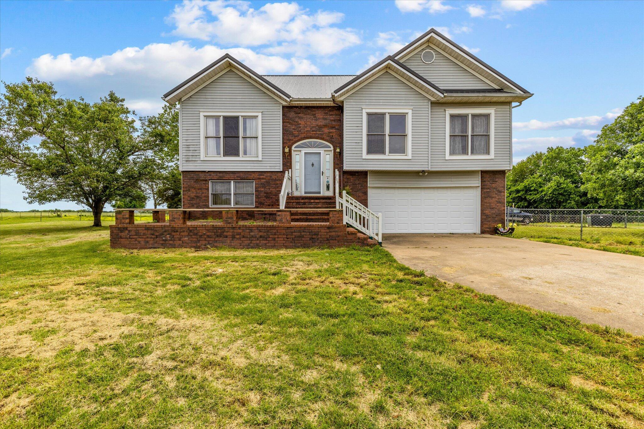 WELCOME TO THE RUNNING HORSE RANCH!Seller is Motivated on this 13.38 Acre 4 Bedroom 3 Bath home that is conveniently located less than 5 mins from I-44. Bring your Livestock/Horses and enjoy this beautiful country setting. Detached 30x30 Morton Building, 6 Stall horse barn and 45X30 Barn with large lean-to makes this property stand out from the rest! Approximately an 8 Acre  5- wire fenced pasture has been proven to be a good producer of hay in the past or could be used to graze more animals. This Well-Designed home offers a NEW Metal Roof installed in 2020, Multiple Wood-burning fireplaces, Kitchen and dining combo with a Formal Dining room, access from the kitchen to a Large Deck, Covered Patio, Downstairs for possible Ranch hand quarters or a place to house your In-Laws, Home Water Filtration System and many more features that will have to be seen in person! Set up your private showing before it's too late!