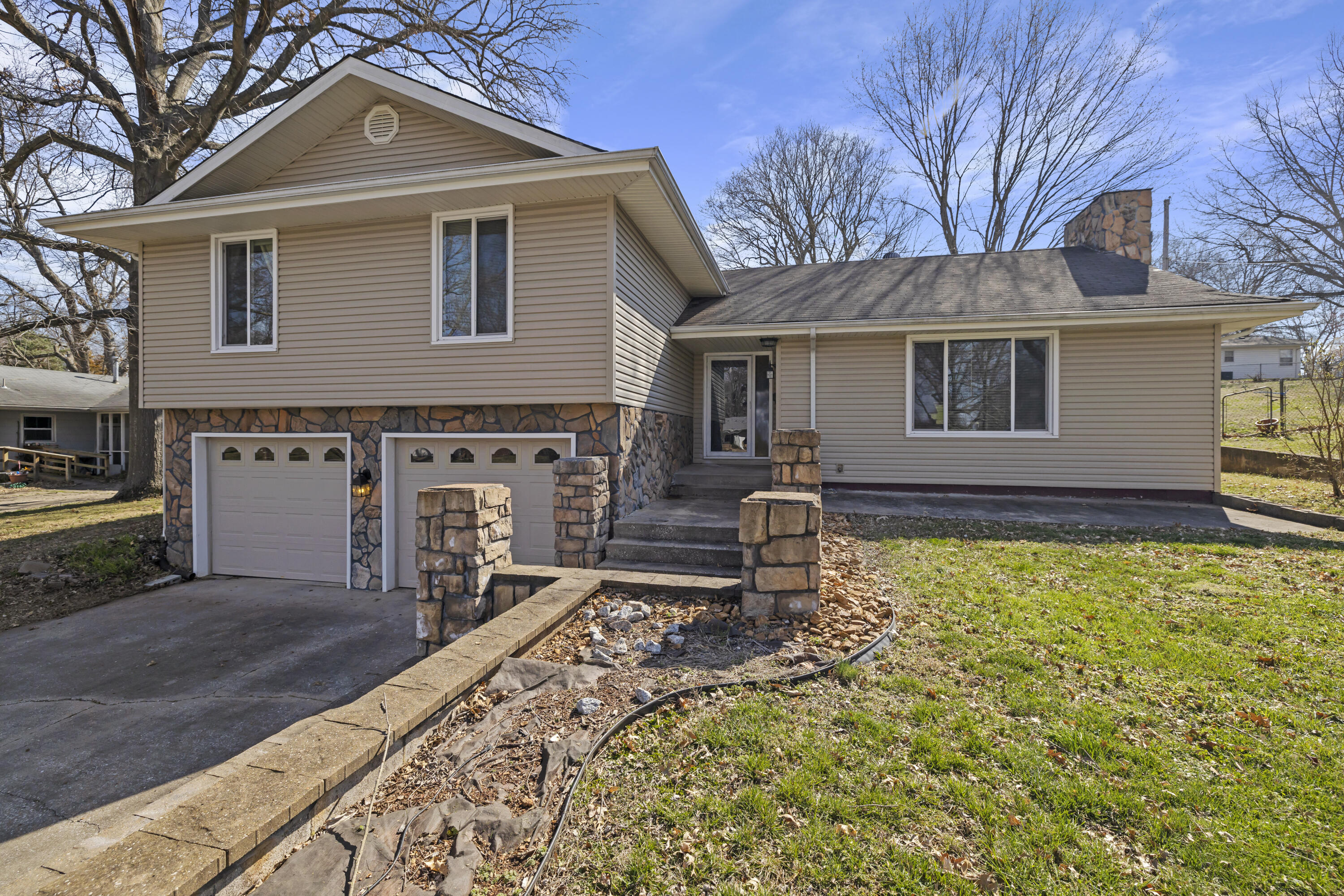Welcome to 2664 S. Catalina!  Beautiful home occupied for almost 12 years by the current owner. Located near the Southern Hills area in one of Springfield's most sought-after neighborhoods. As they say in real estate LOCATION, LOCATION, LOCATION.   This split level home boasts 4 Large bedrooms, 2 full bathrooms, 1 half bath, 2 living areas (or 5 bedrooms your pick) and a 2 car garage! The house has massive curb appeal with new siding, masonry work, new guttering, a black front door and beautiful concrete steps to walk in through the front door.  The master bedroom with en-suite bathroom is extremely spacious and convenient.  You will love the new vinyl plank flooring upstairs,  new dark stained stair treads, tile in the kitchen/dining area and huge sliding glass door that outlooks the giant backyard. The house is completely fenced in perfect for the doggo's to run free and expend some much needed energy. The back yard feels like home with an amazing s'more roasting spot, and a wall separating two sections of the backyard making it perfect for any outdoor event, entertaining or playing catch.  The current owner has great relationships with the neighbors and said it was an extremely quiet, calm neighborhood. Mature trees on the property and all in the neighborhood. Beautiful drives near the Southern Hills Lakes and easy access to Battlefield Road and Hwy 65. You do not want to miss your opportunity to capture this rare Southeast location at this unbeatable price.