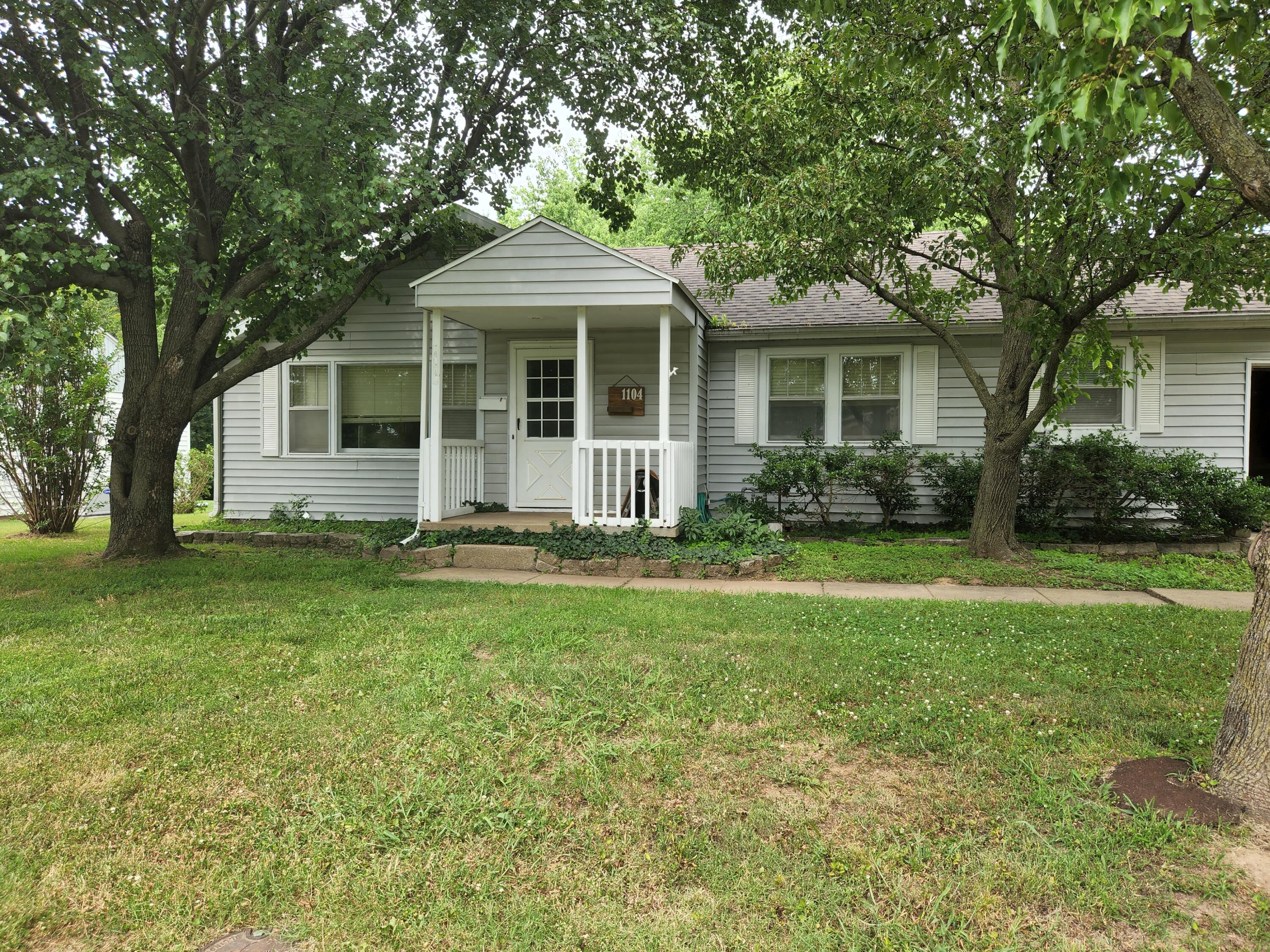 You are going to fall in love! This is a 3 bedroom, 2 bath home with lots of updates. Roof is 2 years old. Remodeled kitchen last year with new flooring, counter tops, back splash and plumbing. New LVP flooring. Large main bedroom with ensuite & sliding glass doors to the deck. Very private fenced in backyard with lots of shade. Close to parks, Cottey College and hospital.
