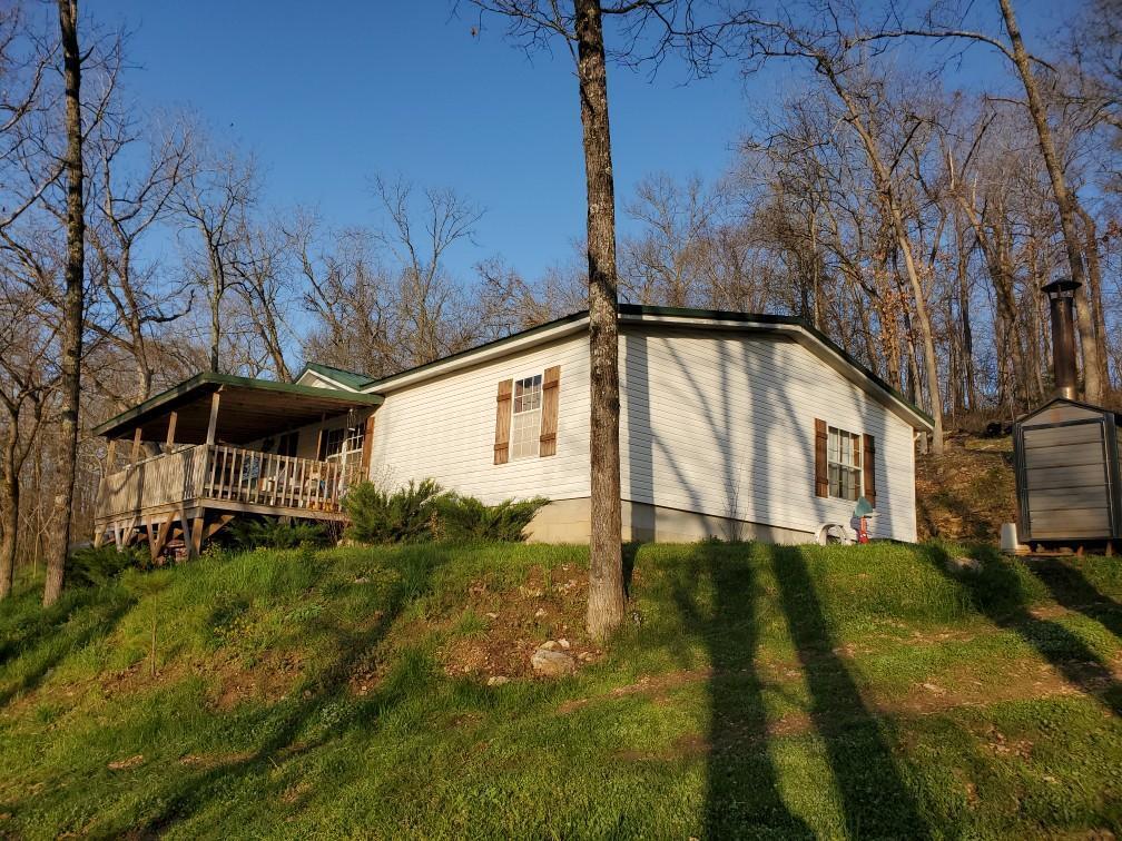 Here it is Enjoy this surveyed 13 acres 3 Bedroom 2.5 Bath custom modular built on a permanent foundation with an open floor plan, central propane heat, newer central air, outside wood furnace, covered front porch, small spring, storage building and private drilled well. Property is all woods with marketable timber. Several signs of deer and turkey on the property . Property is located with-in approx. 3.2 miles from Gasconade river access, 1 mile from Elk Creek access, an hour to Lake Of The Ozarks, 1.5 hours to Bull Shoals or Norfork Lakes , 20 minutes to Hartville, 30 minutes to Lebanon an hour to Springfield