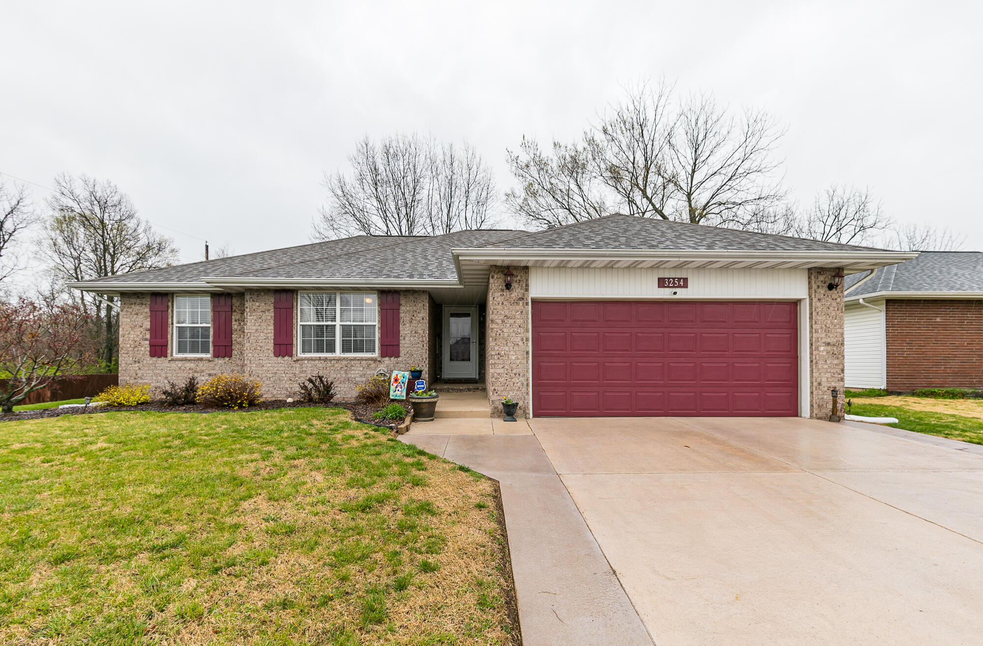 This 3 bed, 2 bath beautifully updated home with hardwood floors sits on a nearly 1/2 acre, gorgeous lot surrounded by nature and wildlife.  The spacious kitchen includes a fabulous gas stove and oven for those buyers that love to cook, along with the newer refrigerator and microwave and kitchen island.  A large master bedroom will accommodate a king size bed with room to spare.  The spacious living room includes a warm, inviting gas fireplace for cool evenings and  vaulted ceilings.  From there, large patio doors lead outside to the patio, and the wonderful new building for extra storage space.  There are so many upgrades to this home including the extended driveway and wonderful landscaping.  Come see this home before it's gone!Home includes a 1 Year Home Warranty capped at $600