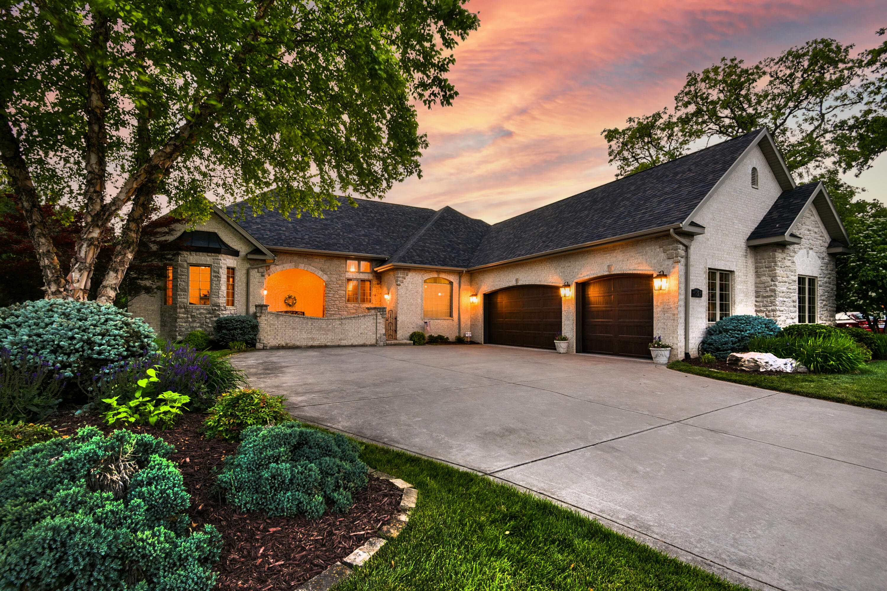 French-Country, Brick Home with PRIVATE back yard on a cul-de-sac in Rivercut, an award winning public golf course community with a country club feel!  The private wooded views are perfect for watching deer, birds, and other wildlife from your screened room.  The architect and designer's attention to detail and the 2018 renovation have created a home that has a relaxed, yet elegant feel.This South Springfield community features upscale homes, community pool, walking trails nearby, and many other amenities and is convenient to shopping and highly rated schools.This  home's dual front entrances and floorplan give the home flexibility for a myriad of users:  families, extended family living, those working from home, those who love to entertain, or simply a couple who enjoys privacy with space for hobbies. Upon entering the foyer, your eyes are drawn straight through to the elevated view of the backyard; you look through the living room, with fireplace, through the wall of windows onto the screened room, which also has a vaulted wood ceiling.  The living room flows seamlessly to the screened porch.There are several options for indoor formal and informal dining as well as outdoor dining.  The large light-filled kitchen is its own space but is also open to the living room and informal dining and has newer stainless appliances, and two ovens.  The upstairs has a split floor plan.  The Owner's Suite is on one side and includes a private coffee bar, with mini fridge and an attached glassed-in porch to enjoy reading or use as your own private yoga studio.  The owner's bath is roomy with a large walk-in shower with dual shower heads, a jetted tub and double vanity and connects to the walk-in closet with a door to the laundry room.The opposite side of the home has two bedrooms and a guest bath. The front bedroom hosts a vaulted ceiling and an exterior entrance.  The current owners use this space as a home office, but could be used for extended family living.