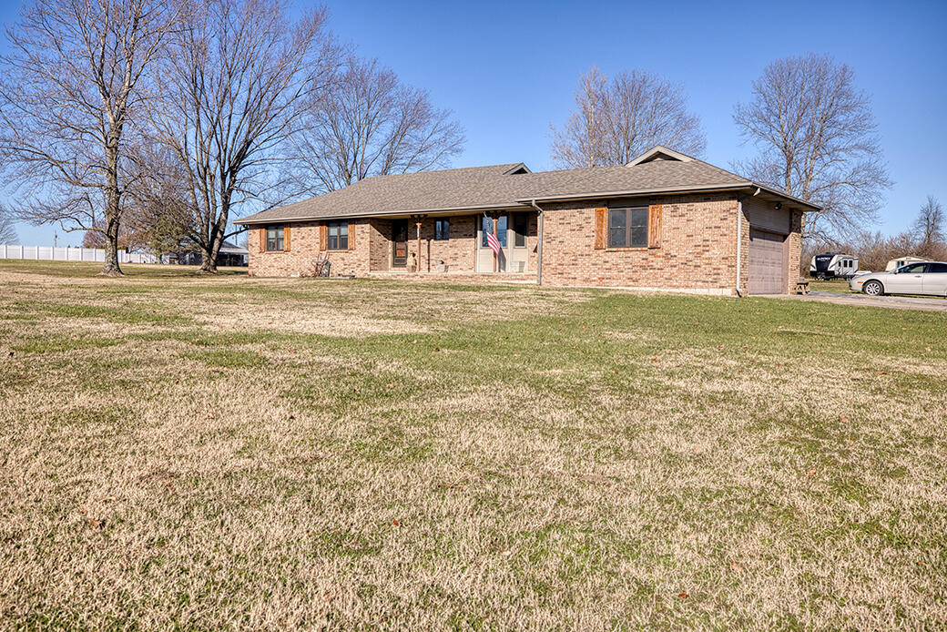 One owner, brick home on 5 acres in Republic School District! This 1765 square foot, 3 bedroom, 2 bath home has newer floors, updated bathrooms, eat in kitchen and formal dining room with a built in cabinet, farmhouse sink, newer lighting and blinds and a 6 year old roof. Air to air heat pump is 5 years old and the attic fan motor was replaced 2 years ago. There is a wheelchair ramp in the garage for easy access.