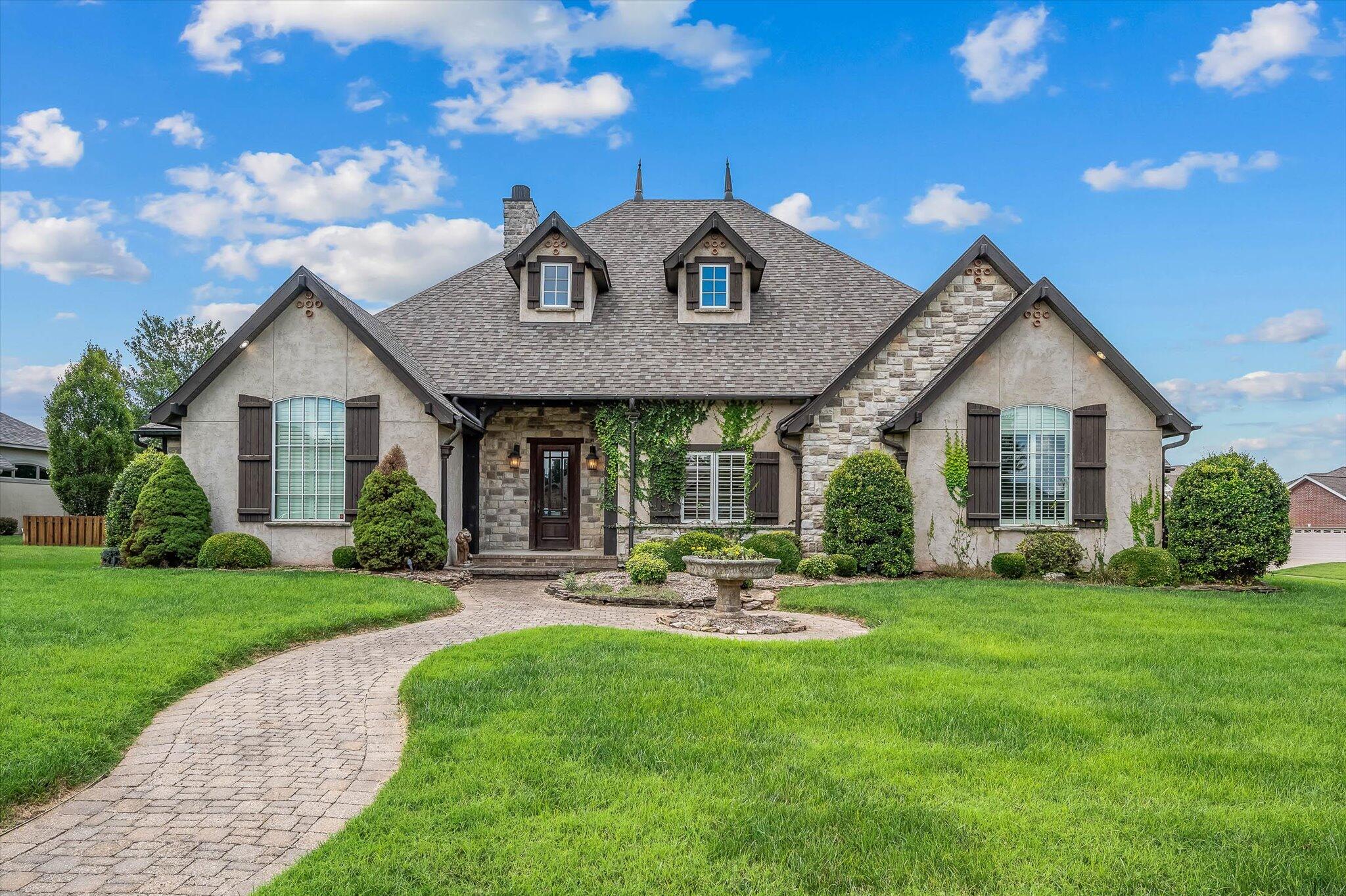 Custom built large open floor plan - large corner lot - Eaglegate Subdivision!! This home has all the quality and detail that your Buyer has been looking for! Featured in this home are 5 bedrooms - 4 bathrooms - 3 car side entry garage with built in storm shelter - bonus room with full bathroom which can be utilized as the 5th bedroom or media or private suite! Newer roof in 2021 - impressive high ceilings with a variety of wood and beamed treatments throughout - faux and textured walls, plantation shutters, crown molding, numerous built-ins and hardwood flooring. The Gourmet kitchen includes granite countertops, abundant cabinets and commercial stainless steel appliances with an industrial vent system. Additional features include sound system, water softener, 2 super sized stone fireplaces - 2 water heaters and zoned forced air HVAC System - extensive landscaping - covered and open patio - exterior copper guttering - John Deere room accessed through the back of the home. The list just goes on and on!!!! Call today for your showing!