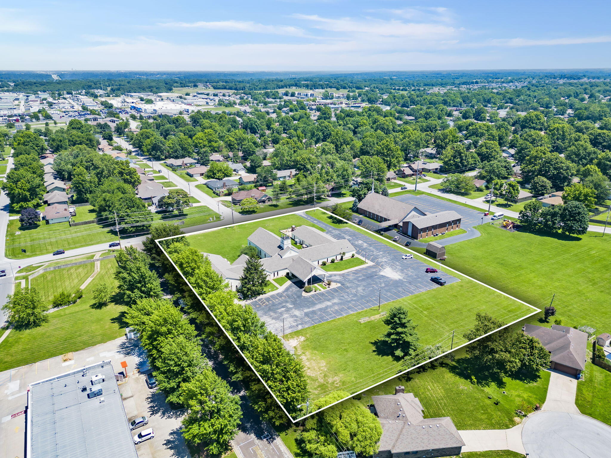 Welcome to 400 Northview in Nixa, MO! This property spans over 17,000 sq ft and includes a spacious sanctuary, meeting hall, commercial kitchen, 5 offices, and 12 classrooms, ideal for a growing church community seeking to establish a larger presence in Nixa. The property boasts 77 asphalt parking spots with two curb cuts, ensuring convenient access. Situated on a 2.99 acre corner lot in central Nixa, there's ample room for outdoor activities and events. The sanctuary accommodates up to 200 seats, expandable to 250 within fire safety guidelines. Additional personal property like chairs and tables can be purchased separately. Current use is exempt from property taxes on the building. Excellent location behind Big Whiskeys and Little Caesars. Massey Blvd in Nixa sees an AADWT of 36,000 vehicles per day. Many national retailers are surrounding the property that include: Arvest, Meeks, Harter House, Aldi, Walmart, Walgreens and many more!
