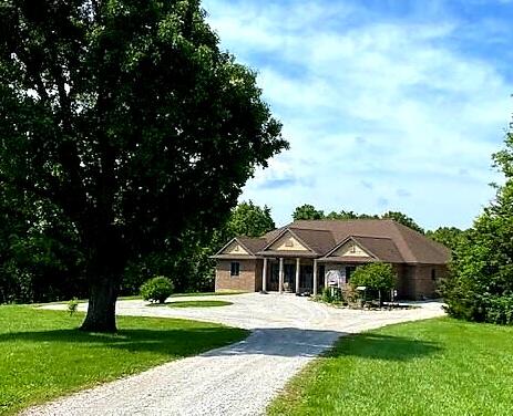 Custom built 2010 brick home with green in mind, VOC-free paint, recycled denim insulation, 3 bedroom, w/one being non-conforming, 2.5 Bath, Geo-Thermal, Anderson windows, covered front porch, great room features beams, stone and wood burning fireplace, pine floor, open kitchen with alder cabinets, granite and hickory counters, tile floor, Wolfe gas range, large laundry off kitchen, main level master, bamboo floors,  large cedar lined closet, tiled master bath soaking tub, bidet, walk-in shower, den with cherry floors and custom built-ins, screened rear porch accessible by great room or den, main level guest bedroom with bamboo floors and oversized full bath, built in speakers, security system, Bosch on demand tankless water heater plus 2nd water heater, hospital grade air purification system, Geothermal ground source heating and cooling, large family/theater room in basement, huge unfinished storage and workroom, non-conforming bedroom, wine cellar which could be storm shelter, walk-out basement, private well, lagoon, Spring, spring branch, fenced garden area, potting shed, 2 story workshop with electric, 129 acres of approximately 10 acres of pasture and the remainder wooded.  Wet weather creek with spring.  All located in rural Missouri, close to Piney River access, State parks, National Forest, excellent whitetail deer and turkey hunting.