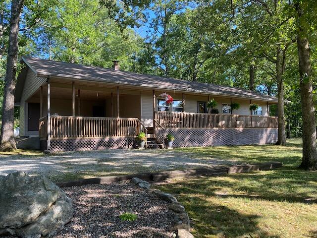 Tucked in the trees is this beautiful, one level, ranch home that's for sale in our Southern Missouri Ozarks! Well-maintained and just as neat as a pin, this opportunity will be gone very soon! An open floor plan offering 3 bed/2 bath, master suite, laundry room/mud room, carport with storage. New furnace, newer roof, private well, septic, landscaped, a pond in front of the house and Centurylink Internet! The field, with small barn, is fenced for your livestock or you can cut the hay. The sunsets are spectacular at this home we've nicknamed ''Evening Shade.''