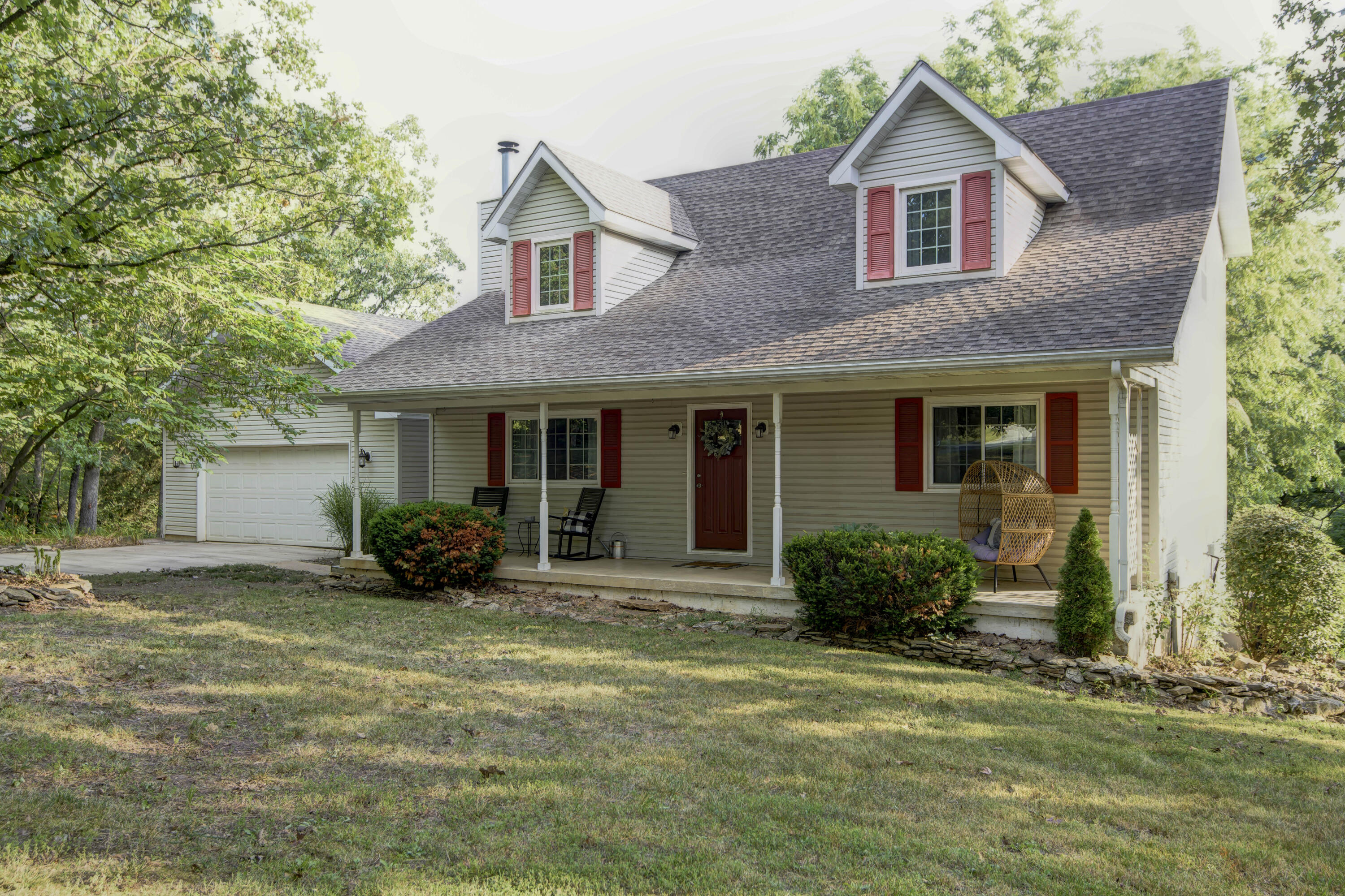 Beautiful farmhouse located on 10 acres! The huge covered front porch is perfect for sitting outside watching the wildlife. Walk into the front door and immediately feel the openess of the home. The tall ceilings give a huge sense of openess in the living room. The fully remodeled kitchen has all new countertops, cabinets and new appliances! The main level features 2 bedrooms and 1 full bathroom. Upstairs is a loft-style sitting area and a huge master bedroom with fully remodeled master bathroom! The bathroom features a gorgeous sitting tub and a massive tile shower, plus double sinks with new counters and vanity. Downstairs has a massive storage area plus another bedroom, living area and bathroom! Outside has an above-ground pool, huge deck, tons of landscaping and mature trees. Last but not least there is a very large workshop that includes space for 2 car garage, concrete floors and electric for all of your workshop desires. The property also has a wet weather creek that run through it and a ton of wooded and cleared land. Roughly 5 acres is fenced in. Fair Grove school district. These opportunities don't come very often! Call today for your showing!