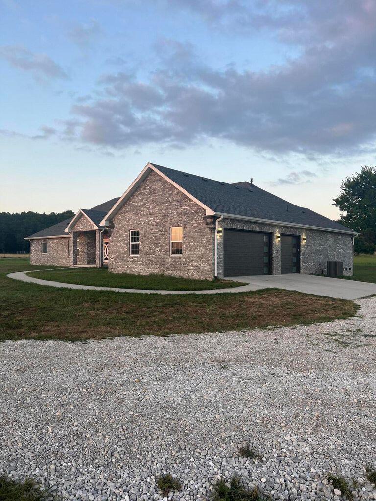 Don't miss out on this one ! Newly built in 2020 . One story all brick home with soaring ceilings , so much open space that's perfect for hosting ! Enter through the double doors to a living room featuring 19 ft vaulted ceilings , a fireplace , & a whole wall of windows with picturesque views for days . Enormous kitchen decked with soft close cabinets , granite & back-splash, walk in pantry , and other modern conveniences like a pot filler faucet & instant hot water dispenser . All kitchen appliances stay with home ! Master bedroom with walk in closet & an en suite bathroom with walk in shower, whirlpool tub & double vanities . 4 bedrooms + an office . Lots of wildlife to see from under the covered back porch ! 10.96 acres , 3 car garage , soundproof walls throughout home , commercial well , instant hot water dispenser , tank-less water heater , heat pump . 1000 gallon underground propane tank . Come see this charming house & make it your forever home !High speed internet coming soonHome has just been repainted & is waiting for its new owners !