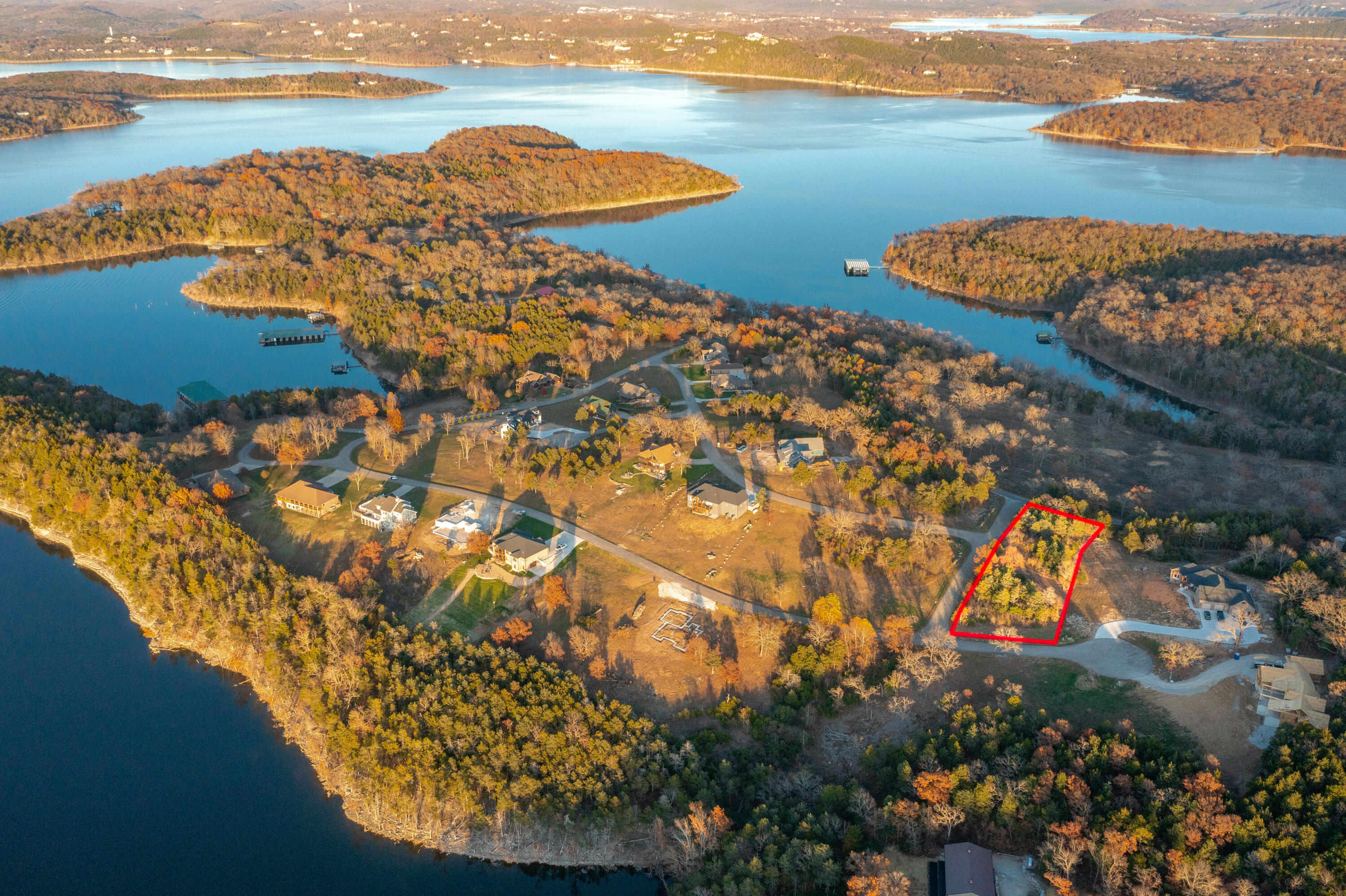 Fantastic Table Rock Lake views! This large lake lot is ready for your new home. Bread Tray Mountain Estates is a beautiful lakeside community with upscale homes and a sense of privacy while still being located close to Kimberling City. Electricity, community sewer, community well already available. 10 x 30 boat slip available a stone's throw away in a nearby protected cove for additional $$$. Take your golf cart.